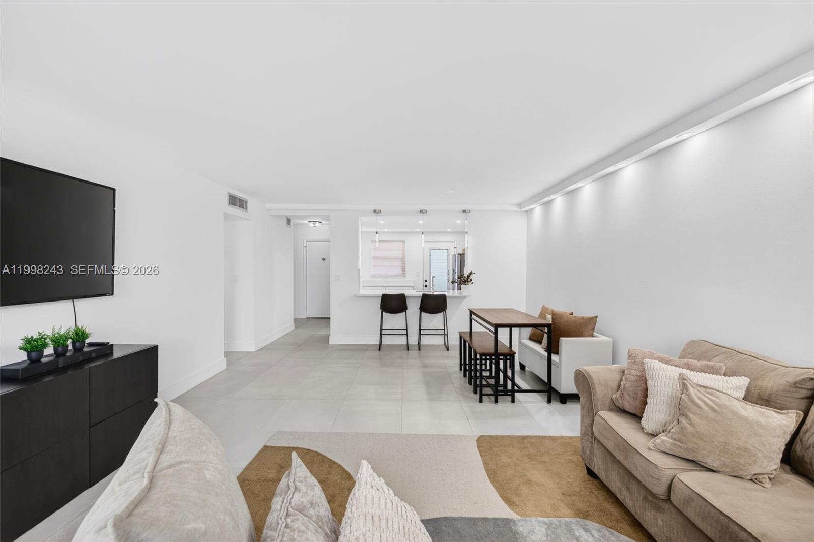 Completely re-imagined and beautifully transformed, this exceptional 2-bedroom condo is a true standout in today’s market. Thoughtfully redesigned by its current owners, every detail reflects a clean, modern, and sleek aesthetic—now ready to be enjoyed by its next lucky owners. The open-concept layout creates a seamless flow between living, dining, and kitchen spaces, enhancing both functionality and style. The spacious, fully renovated kitchen is the heart of the home, featuring contemporary cabinetry and quality finishes. Both bathrooms have been remodeled with modern touches, complementing the home’s cohesive, updated look. Throughout the unit, you’ll find a harmonious blend of new, renovated, and upgraded elements that elevate the overall living. Brand-new impact windows are being installed, adding peace of mind and energy efficiency. Located in a quiet boutique building in the heart of Hallandale Beach, the condo offers a more intimate and private living environment while remaining close to everything. Ideally positioned east of US-1, you’re just minutes from the beach, Fort Lauderdale and Miami airports, world-class dining, shopping, and entertainment. Surrounded by exciting growth and development—including new residential and commercial projects transforming the area—this location continues to gain momentum, making it an attractive opportunity for both end-users and investors alike. A rare combination of style and location—this is the one you’ve been waiting for.