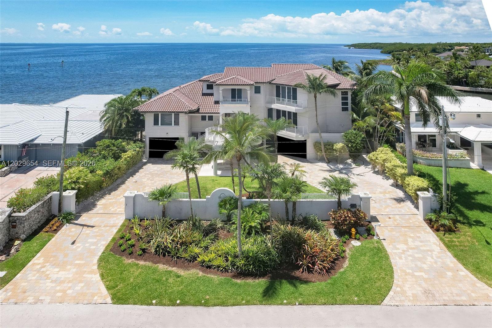 Casa Dos Aguas - Rarely available, this extraordinary waterfront residence offers one of South Florida’s most coveted settings on a private peninsula within the exclusive, gated Gables by the Sea community in Coral Gables.  It offers breathtaking open water views of Biscayne Bay to both the north and south, with a stunning downtown Miami skyline backdrop.

Designed in the spirit of mid-century modern architecture, living areas are  elevated on the second floor and additional bedrooms on the third - maximizing the spectacular panoramic bay views enjoyed from virtually every room. A three-story elevator provides effortless access throughout.

Boasting 100 linear feet of deep-water frontage with no fixed bridges to Biscayne Bay, the property is a true yachtsman’s dream, capable of accommodating a large yacht with direct, unobstructed access to open water. The roof was redone in 2013 and has all-impact windows and doors.

Designed for the South Florida lifestyle, the home features generous balconies to savor the constant bay breeze and sweeping water vistas, while the ground floor offers an expansive covered entertainment area perfect for hosting. The resort-style pool includes an in-pool spa and is heated for year-round enjoyment.  Located just three properties in from the bay within one of Coral Gables’ most prestigious gated enclaves, this is a rare opportunity to own a true waterfront trophy property.