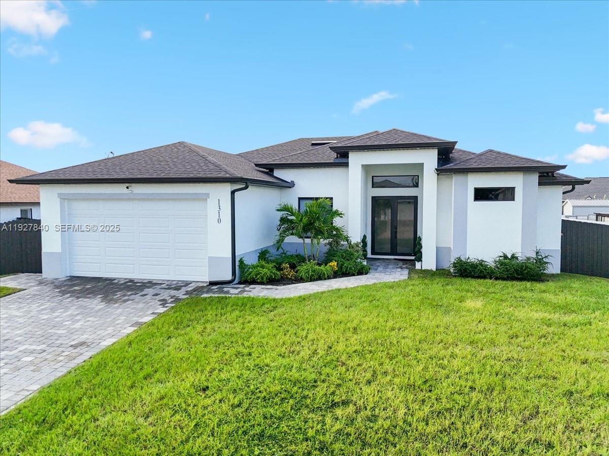 FALL IN LOVE! Built in 2024, this modern 3-bedroom + den, 2-bath Cape Coral home offers style, comfort, and smart upgrades throughout. The light-filled open floor plan features porcelain tile flooring, contemporary lighting, and a sleek kitchen with waterfall quartz island, and quartz countertops that extend into both bathrooms. Sliding barn doors open to a flexible den ideal for a home office or media space. The primary suite includes a tray ceiling, walk-in closet, and spa-inspired bath with soaking tub, glass shower, and dual vanities. Impact-resistant windows and doors provide added security and storm protection. Enjoy outdoor living with a fully fenced yard, outdoor kitchen, and plenty of room to add a pool. Conveniently located near Mariner High School, Mariner Middle School, Northwest Regional Library, minutes to Coral Oaks Golf Course, and approximately 10 minutes to a public boat ramp. Move-in ready and designed for modern Florida living.