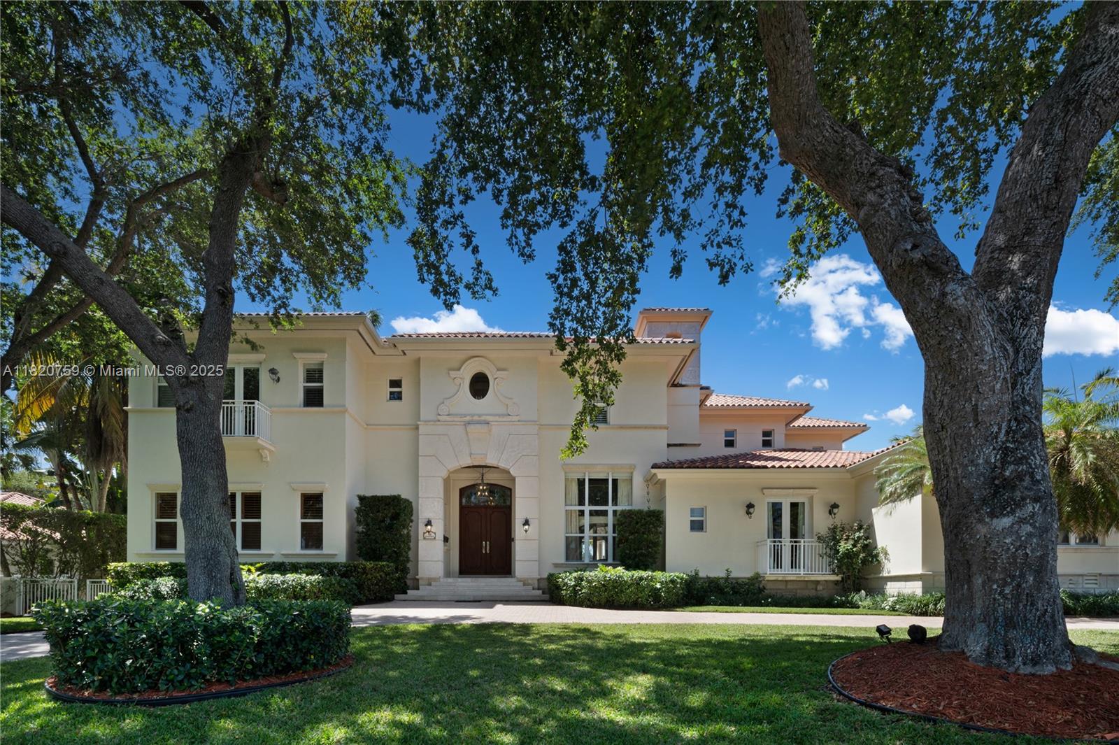 Elegant and expansive waterfront estate in guard-gated Old Cutler Bay. This 6BD + Den/7.5BA home offers 148 ft. of water frontage on a 28,000 SF lot offering the ultimate in privacy and luxury living. A grand double-door entry opens to a soaring foyer with Venetian plaster walls, wrought iron staircase, and marble floors. Designed for both comfort and entertaining, enjoy spacious living areas, a gourmet kitchen with a walk-in pantry, a library, den, elevator, impact windows, generator, and 3-car garage. All bedrooms are en-suite, including a luxurious primary suite with dual closets and spa bath. The serene outdoor space features a summer kitchen with Argentine gaucho grill, retractable screens, cabana bath, and sweeping water views—perfect for gatherings or quiet evenings at home.