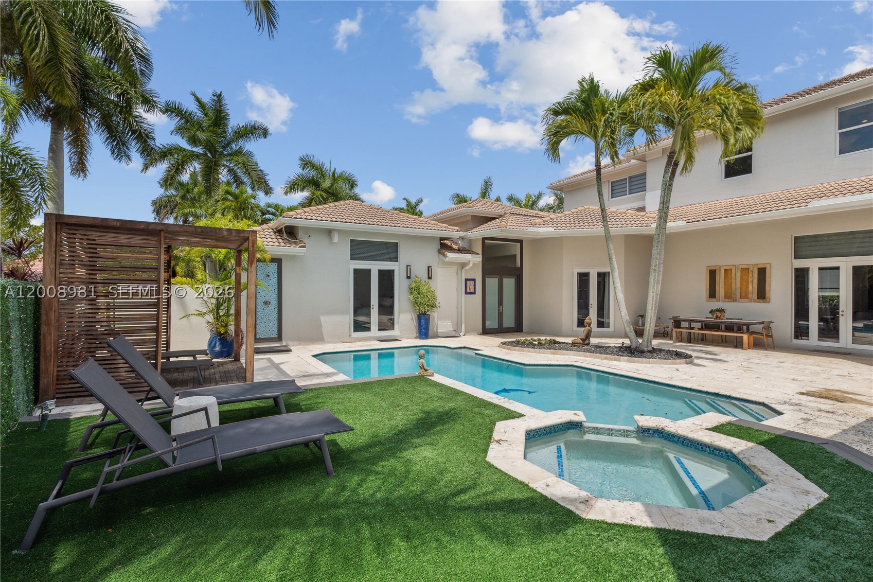 Experience the perfect blend of elegance and privacy in this stunning Courtyard-style residence located in the prestigious Weston Hills Country Club, this home welcomes you with a heated pool and spa at the center of the property. The main residence features 4beds, 4.5 baths, plus a dedicated office, with 2 beds privately situated on the 2nd floor and the remaining suites on the first level, the property includes a fully independent Guest House, which serves as the 5th bedroom, complete with its own private entrance, kitchenette, and full bathroom. Expansive living areas showcase vaulted ceilings, abundant natural light, and a seamless flow toward the outdoor spaces. The home has been freshly painted, includes impact windows, and boasts a NEW 2024 roof, providing long-term peace of mind. The gourmet kitchen includes stainless steel appliances, wood cabinetry, and a large island perfect for gatherings. The home also features a temperature-controlled wine storage area, ideal for collectors or those who love to entertain. Step outside to the rear terrace and enjoy a pergola-covered lounge, built-in BBQ, outdoor fireplace, and serene side-garden views an exceptional setting for hosting and year-round enjoyment.Additional features include a 3-car garage, outdoor pergola, BBQ island, and exceptional privacy throughout. Located in the exclusive Weston Hills community, known for its manicured landscapes, golf courses, and top-rated schools.