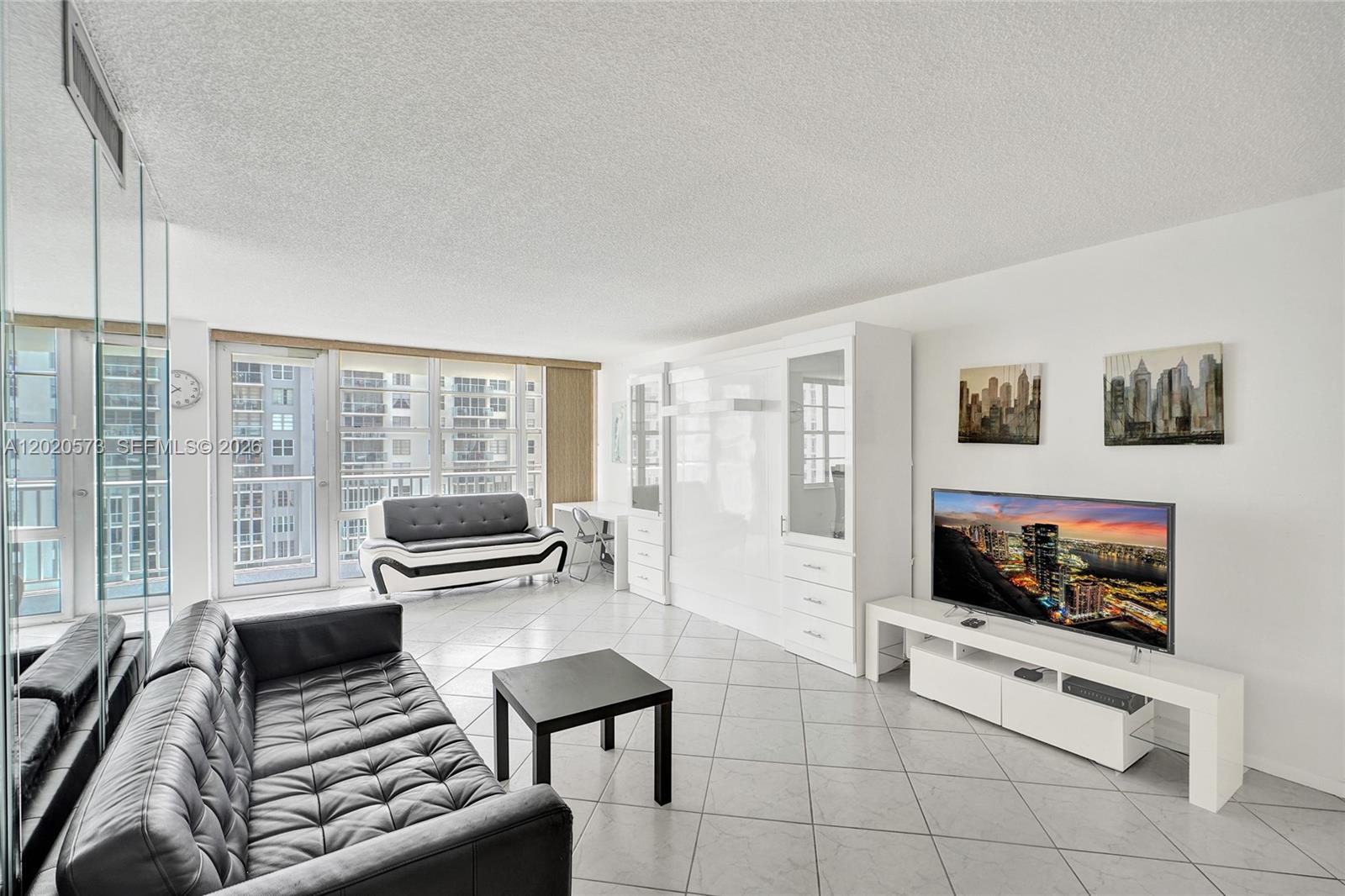 Panoramic ocean, bay, and city views from this spacious 1BD/1.5BA residence in a prime Sunny Isles Beach location! This bright unit offers a great floor plan with expansive windows that fill the space with natural light and showcase views of the Atlantic Ocean, Intracoastal, and skyline. Renovated years ago but well maintained, clean, and ready for a new owner. Features include tile floors throughout, granite kitchen countertops, large walk-in closet, Murphy bed in the living room for guests, and a balcony recently finished with new flooring. Well-maintained building with low HOA fees. 40-year recertification is complete and 50-year recertification is in progress. Amenities include pool, gym, sauna, tennis, library, billiard/game room, meeting rooms, 24/7 security, and additional storage. Close to the beach, shops, dining, parks, and houses of worship. Amazing opportunity to create your dream home in the sky!

All information deemed reliable but must be verified by buyer/buyer’s agent. Listing agent not responsible for errors or omissions.