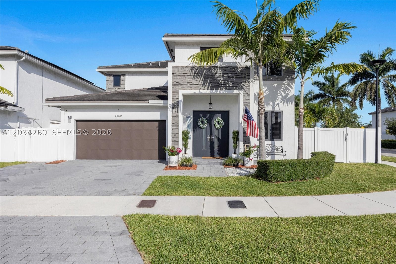 Welcome to this stunning 2-story modern home in The Landings at Miami! Soaring 20-ft foyer ceilings and grand double-door entry set the tone from the moment you arrive. Open floor plan features a spacious great room, tile floors throughout main level, formal dining, and a fully equipped in-law suite with private side entrance, kitchenette, full stone bath, bedroom and closet — ideal for multigenerational living.
Upstairs enjoy a massive owner's suite with two walk-in closets, luxurious private bath, loft area, two additional bedrooms and second-floor laundry. Step outside to your private resort: heated pool with LED lighting, sun shelf, travertine pavers, pergola with string lights, outdoor kitchen, fire pit, artificial turf and full vinyl privacy fence. Well irrigation included!
Community amenities include resort-style pool, clubhouse, walking trails and dog parks.