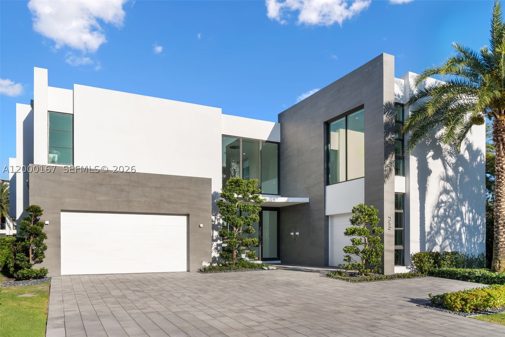 Welcome to Casa Aqua, Where Modern Design Meets the Open Sea, an architecturally award-winning waterfront estate offering the pinnacle of South Florida luxury living. Built in 2020, this stunning modern residence spans approximately 5,484 sq ft of impeccably designed interior living across two stories, complete with a private elevator and 3 car garage.
Positioned on 100 feet of deep-water frontage with direct canal access and no fixed bridges to the ocean, this is a true boater's paradise, docking vessels up to 80 feet with effortless access to the open sea. Minutes to Hillsboro Inlet.

Walls of glass and soaring ceilings flood the interiors with natural light, while the open-concept layout is anchored by a chef's kitchen with premium Thermador and Bosch appliances. The residence features 5 spacious en-suite bedrooms including a private primary suite, 6 bathrooms, a loft and club room, designer smart LED lighting with Bluetooth in-wall sound system, and a private heated saltwater pool surrounded by natural stone hardscape and premium landscaping.
Over $500,000 in recent enhancements elevate this estate beyond compare, including a new concrete dock with upgraded pilings, custom fireplace, illuminated baseboard fire riglet feature, and a curated exterior featured in Modern Home magazine.
Located moments from the beach, dining, boutique shopping, and FLL airport. Casa Aqua is even better in person! Schedule private tour today!