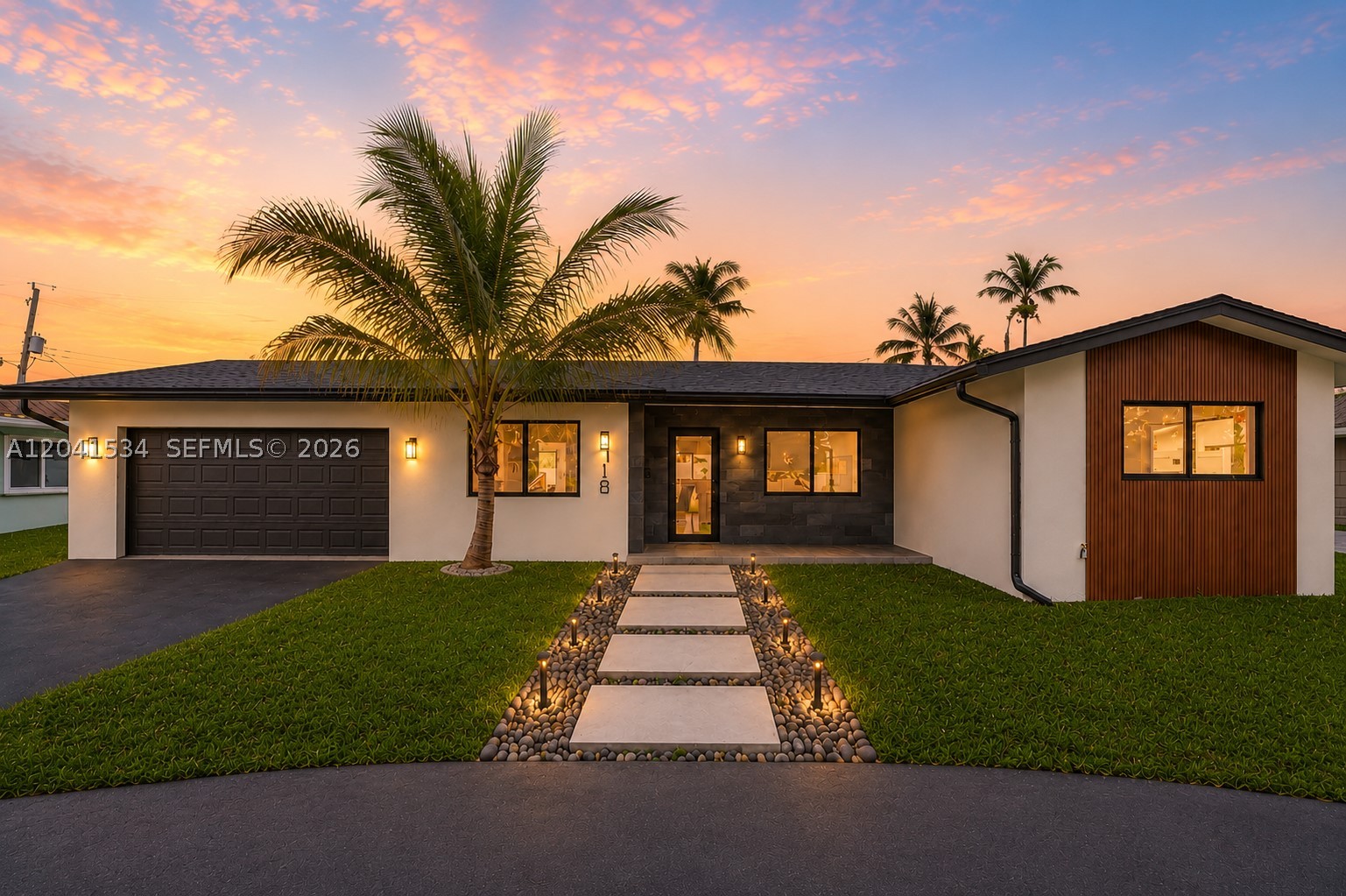 Welcome to Casa Isles! This completely redesigned 4-bedroom, 3-bath pool home with a spacious two-car garage blends luxury, style, and modern functionality. Step inside to a bright, open-concept floor plan featuring expansive living spaces, abundant natural light, and premium designer finishes throughout.
The stunning gourmet kitchen offers custom cabinetry, premium countertops, a designer backsplash, and brand-new stainless steel appliances, seamlessly flowing into the living and dining areas. Beautifully remodeled bathrooms feature oversized designer tile, frameless glass shower enclosures, custom vanities, and premium fixtures. New flooring, interior doors, and fresh interior and exterior paint complete the home's sophisticated design.
Major upgrades include a brand-new roof, impact-rated windows and exterior doors, a new PVC sanitary sewer line, updated electrical system with a Samsung breaker panel, new driveway and walkways, professional landscaping with irrigation, all-new fencing, a renovated laundry room, and a professionally finished epoxy-coated two-car garage.
Enjoy your private backyard oasis with a brand-new swimming pool and all-new equipment, perfect for entertaining or relaxing year-round. Ideally located just minutes from beaches, shopping, dining, parks, and top-rated schools, this truly turnkey home offers exceptional craftsmanship and peace of mind. Simply move in and enjoy South Florida living at its finest.