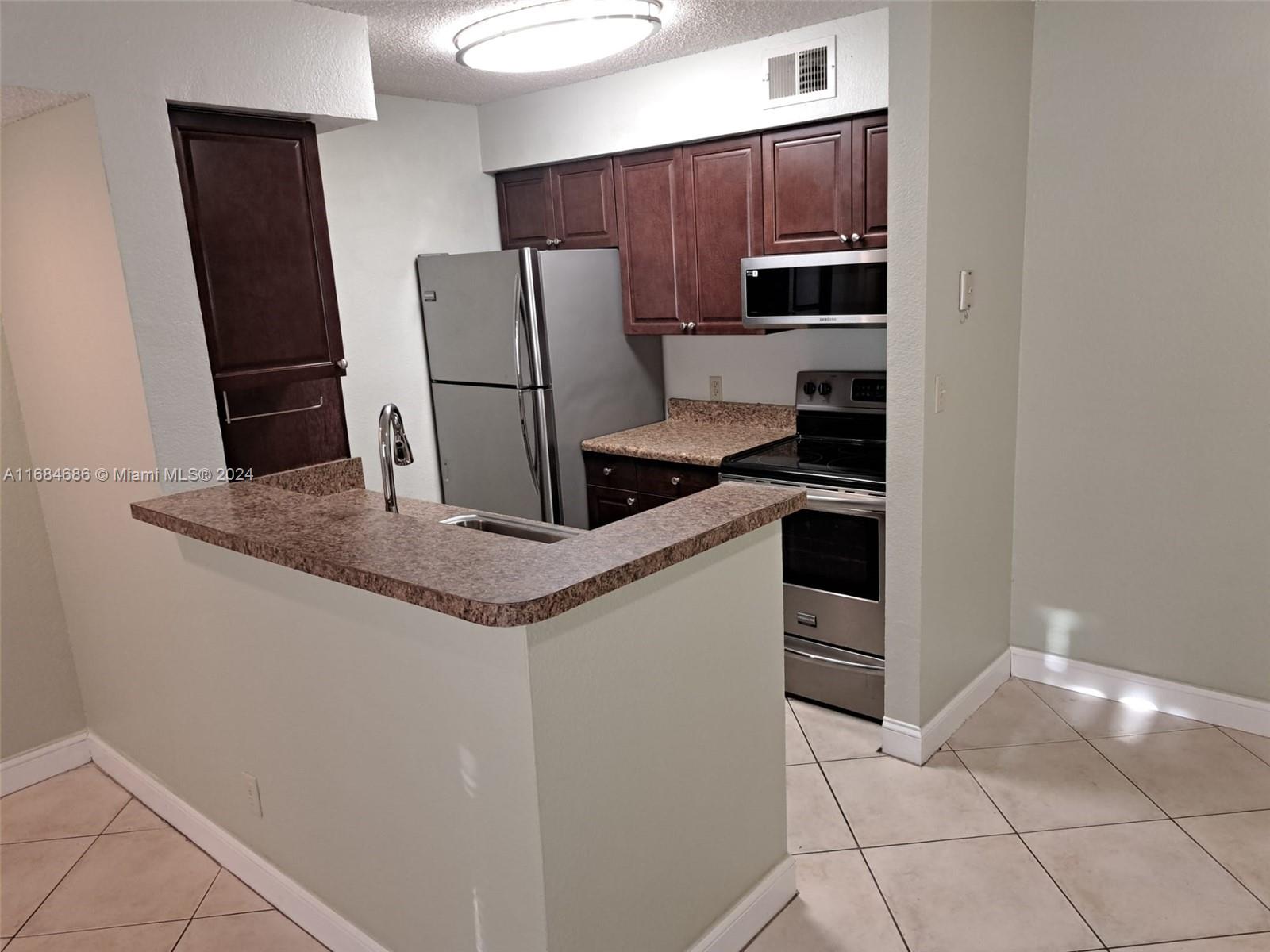 BEST LOCATION, DIRECTLY ACROSS FROM NSU! IDEAL FOR STUDENTS AND STAFF. THIS LOVELY GROUND FLOOR 1-BED 1-BATH UNIT IN SUNDANCE AT DAVIE COMPLEX FEATURES FULL-SIZE WASHER/DRYER IN UNIT, A WALK-IN CLOSET, 2 CEILING FANS, UPGRADED KITCHEN & BATHROOM. WATER/TRASH INCL WITH RENT! TILE FLRS THROUGHOUT EXCEPT IN BDRM WHICH IS PARKAY. POOL/SPA, GYM, TENNIS COURTS, BEAUTIFULLY LANDSCAPED GROUNDS & A PEACEFUL LITTLE FOUNTAIN POND AT CENTER OF COMPLEX. PLENTY OF PARKING. CLOSE TO RESTAURANTS/DINING/ENTERTAINMENT/SHOPPING, WHOLE FOODS & TRADER JOE'S, MAJOR HIGHWAYS. JUST 18 MIN TO FT LAUDERDALE INTL AIRPORT. UNFURNISHED. AVAILABLE NOW! APPLIANCES ARE BEING REPLACED FOR STAINLESS STEAL!