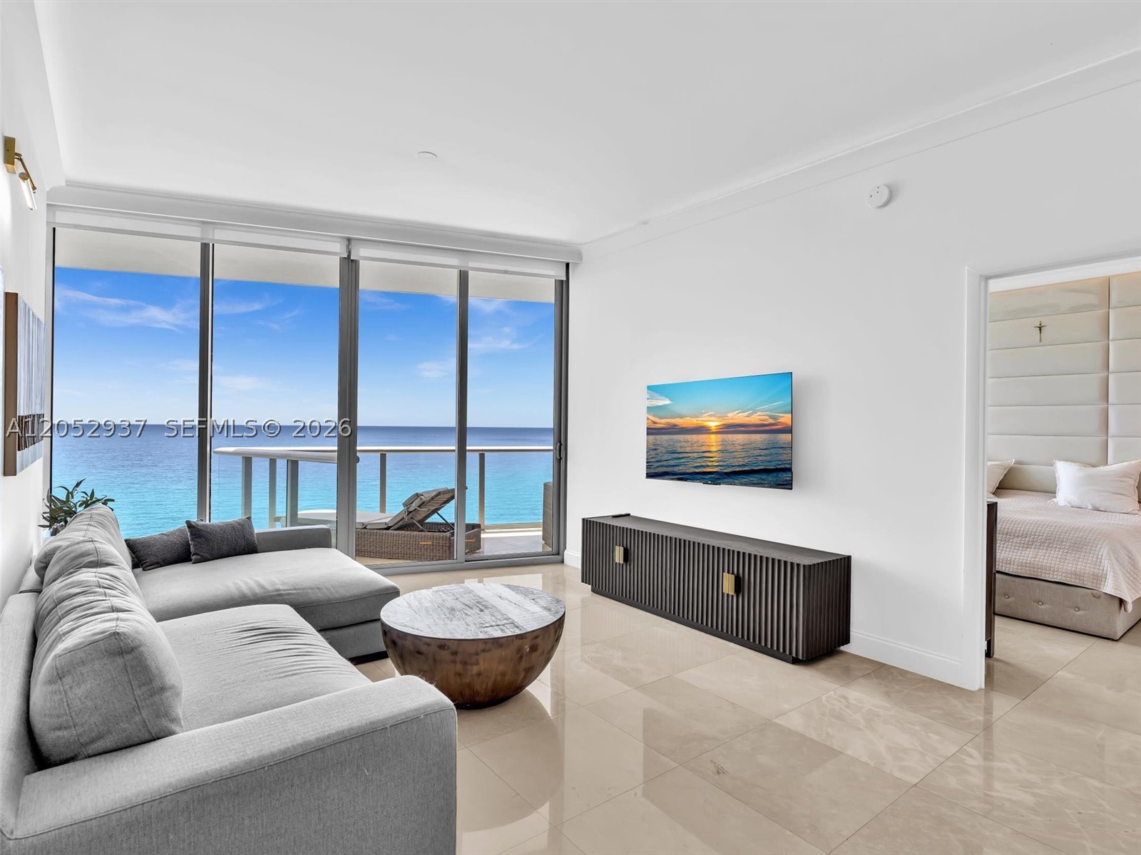 Experience luxury oceanfront living in this beautifully furnished high-floor residence at the prestigious Jade Beach. Offering breathtaking direct ocean views from every room, this spacious 1-bedroom, 2-bathroom home features an open-concept floor plan with floor-to-ceiling impact glass that fills the interior with natural light while showcasing endless views of the Atlantic Ocean. Designed with both comfort and sophistication in mind, the residence features a gourmet kitchen equipped with premium appliances, sleek cabinetry, contemporary recessed lighting, electric blinds, in-unit washer and dryer, and a spacious private balcony accessible from both the living room and bedroom—creating the perfect indoor-outdoor lifestyle. An assigned garage parking space and wifi/cable are also included. Jade Beach offers an exceptional collection of 5-star resort-style amenities, including direct beach access with beach & pool service, a stunning oceanfront infinity-edge pool, a sunset pool overlooking the Intracoastal, a full-service spa with sauna and steam rooms, a state-of-the-art fitness center, poolside café, children’s play area, business center, 24-hour concierge, valet parking & 24 hour security. Ideally located in the heart of Sunny Isles Beach, you’re just minutes from Bal Harbour Shops, Aventura Mall, world-class dining, luxury shopping & parks, offering the perfect balance of beachfront tranquility & everyday convenience. Available now for lease, Schedule your showing today.