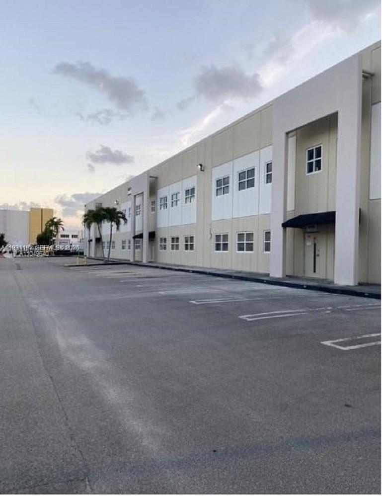 Strategically located warehouse available for lease in the heart of Sweetwater, just minutes from Doral and Miami International Airport. This unit offers a practical layout with high ceilings, excellent accessibility, and versatility for various business operations including distribution, storage, and light industrial use. Property features a welcoming reception area and one private office on the first floor, plus three additional offices on the second floor, ideal for administrative and management use. Located in a well-established industrial park with easy access to major highways, making logistics and daily operations efficient and convenient.