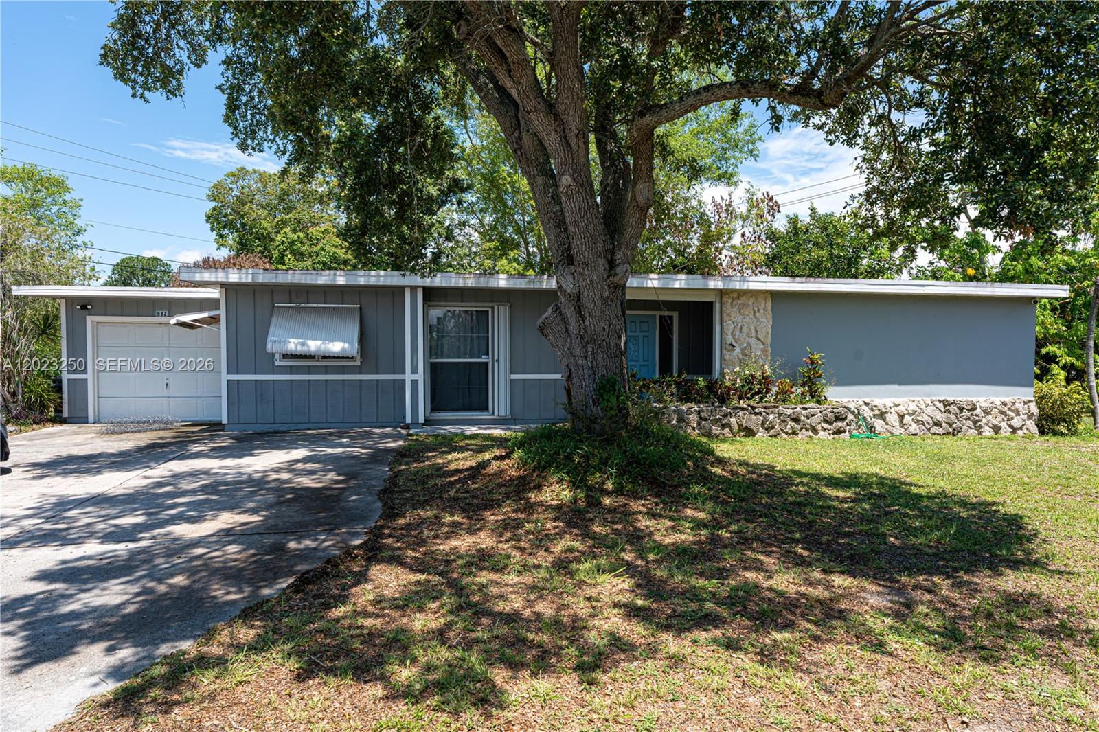 Welcome to this charming 3-bedroom, 2-bath home situated on a spacious .34-acre corner lot in the heart of Port Saint Lucie. Built in 1969, this property offers nearly 2,000 sq ft of living space with an open floor plan, enclosed porch, and an extra-long driveway with plenty of room for boats, RVs, and additional parking. The home features a 2022 roof, central air and heat, hurricane shutters, updated electrical components, and mature tropical fruit trees. Conveniently located near shopping, dining, schools, and major highways, this property offers both privacy and accessibility with endless potential for homeowners or investors alike.