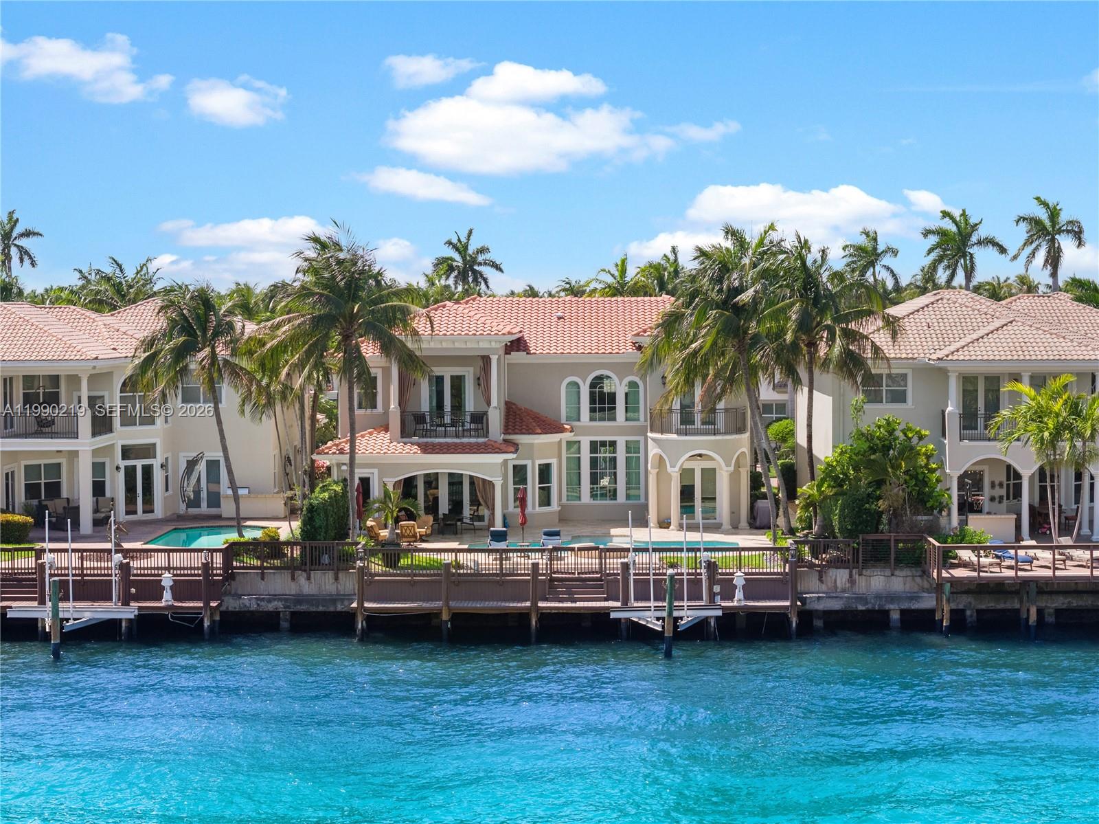 A commanding Intracoastal estate within the exclusive gates of Harbor Islands, where scale, setting, and waterfront presence come together in one of Broward’s most coveted communities. Positioned along 65 feet of canal frontage with direct Intracoastal access, the residence offers a private dock and boat lift, perfectly suited for a seamless boating lifestyle.

Spanning over 5,300 interior square feet, the home features 5 bedrooms, 5 full bathrooms, and 2 powder rooms, along with a dedicated office and den or loft. Expansive living areas are framed by generous proportions throughout, with the primary suite is oriented to capture wide water views, complete with a private balcony and sitting area overlooking the Intracoastal.

Outdoor spaces are designed for entertaining, featuring a heated pool and covered terrace set against a tranquil waterfront backdrop. Residents of Harbor Islands enjoy access to a private marina, clubhouse, fitness center, tennis courts, and a 40 acre park, all just moments from beaches, fine dining, and premier shopping.

This residence presents a rare chance to create a tailored waterfront estate in a premier gated setting.