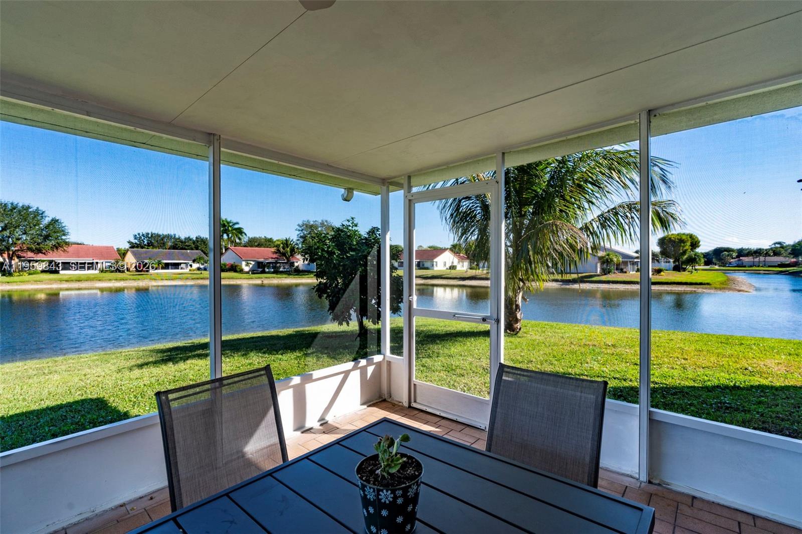 A rare opportunity to own a truly one-of-a-kind waterfront home, ideally situated on a quiet cul-de-sac with only one neighboring property. This beautifully transformed residence offers breathtaking, panoramic water views and a thoughtfully redesigned open-concept layout ideal for today’s living. Interior walls were removed to create expansive, light-filled spaces highlighted by a dramatic cathedral ceiling and decorator lighting throughout.

The enclosed, screened patio is sure to become your favorite retreat—perfect for unwinding while enjoying serene water views. Accordion shutters throughout provide added peace of mind.

Located in a desirable 55+ gated community, this home offers an outstanding location near the Turnpike, with convenient access to Lake Worth Beach, PBI Airport, and the shopping, dining, and amenities of Wellington.