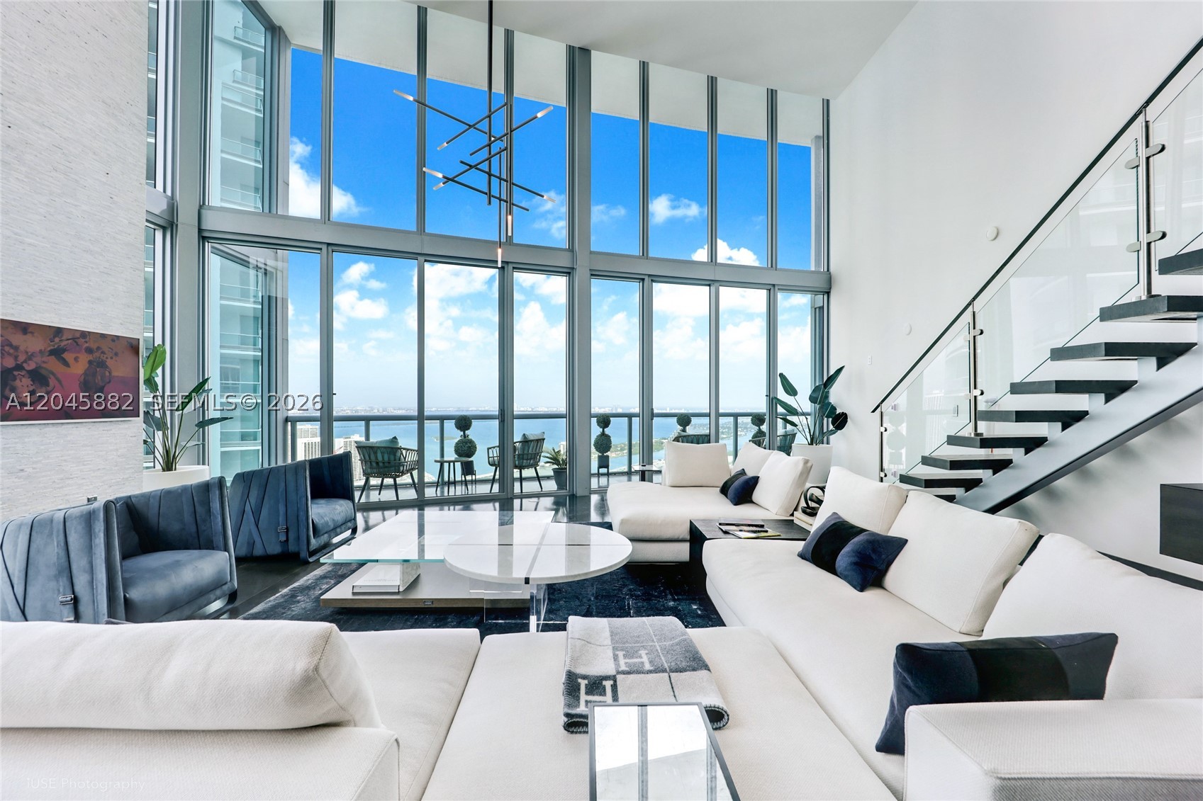 Experience a truly unique penthouse at Marinablue condo in Downtown Miami. This fully renovated residence leaves no detail overlooked, featuring a double-height living area and expansive floor-to-ceiling windows that enhance the stunning art kitchen equipped with high-end Mule appliances. The luxurious master suite offers breathtaking views of Miami. The building boasts resort-style amenities, including 24-hour front desk security, valet parking, a gym, and a pool. Enjoy a prime location just minutes from the beach, the airport, and vibrant neighborhoods like Brickell and Wynwood, filled with excellent shopping and dining options.