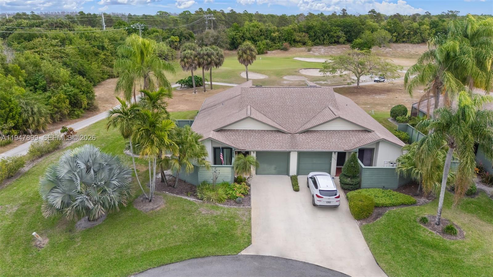 Discover resort-style Florida living in this 2BR/2BA home with an enclosed Florida room, perfectly set along the lush fairways of the Heritage Ridge Golf Course in desirable Hobe Sound. This inviting, move-in ready residence offers a light-filled, open-concept feel with soaring ceilings and a comfortable, spacious layout. The generous kitchen is both stylish and functional, featuring stainless steel appliances, granite countertops, warm wood cabinetry, and ample prep space—ideal for casual meals or entertaining guests. The oversized primary suite provides a relaxing escape with abundant closet storage and a private en-suite bath. Step outside to enjoy tranquil golf course views and gentle breezes from the screened porch, plus the rare benefit of a fully fenced patio—this is the only unit in the community offering this added privacy. Key improvements include new impact windows and doors and a newer roof for peace of mind. Heritage Ridge residents enjoy access to golf, tennis, a community pool, and more. Conveniently located near Hobe Sound’s beaches, Jonathan Dickinson State Park, waterfront dining, and charming local shops—this home delivers the perfect blend of serenity, convenience, and coastal lifestyle. Enjoy morning coffee, sunset skies, and the easygoing charm of golf course living. A rare find in a beautifully maintained community! Schedule your private showing today. All information deemed reliable but not guaranteed. All measurements are approximate.