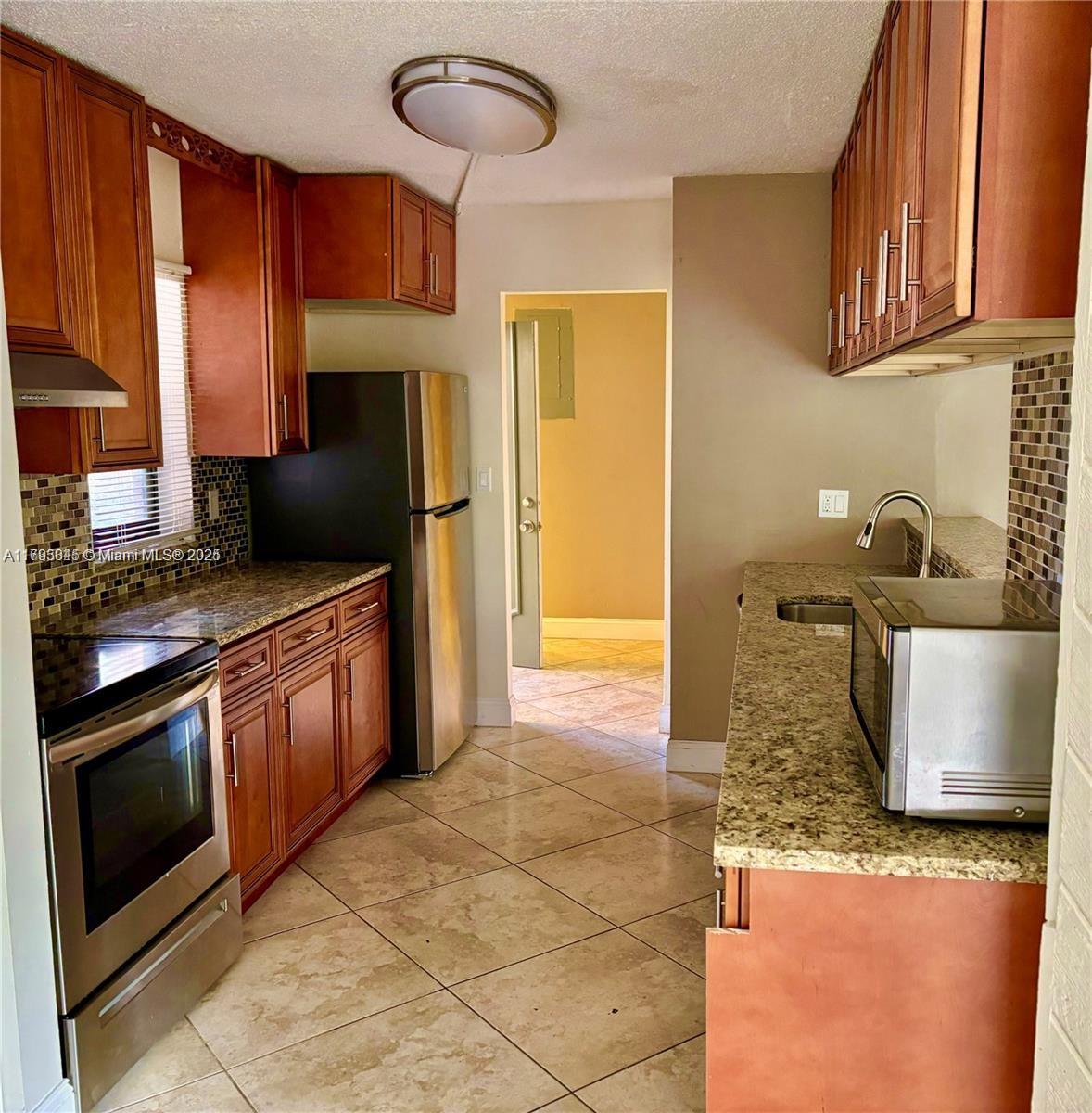 Large unit with patio on first floor, 2/2 at Le Chateau Condo.This first floor unit features approx. 1,200 sq ft with tile flooring throughout, a bright open living/dining area. The main bedroom includes a walk-in closet and private bath. Unit comes with in-unit washer and dryer, assigned parking, and plenty of guest parking. Conveniently located near shopping, dining, and major highways. Fast approval—ready for immediate move-in! Easy to show.No pets.