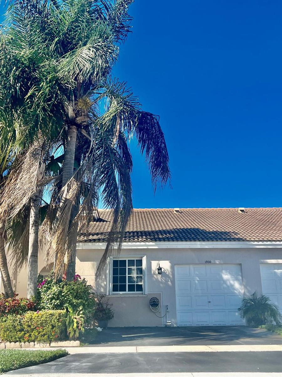 Stunning fully remodeled 2/2 lakefront villa in the Village of Renaissance! This home features a 3-year-old roof, energy-efficient A/C, a 1-car garage with space for 3 cars, and an integrated surround sound system. The modern kitchen boasts stainless steel appliances, a beautiful countertop, and plenty of cabinet space. Each room has its own updated bathroom. Enjoy lake views from the kitchen, living room, and master bedroom, all with hurricane shutters. The fenced backyard offers privacy and scenic views. The gated community includes tennis courts, a large pool, and easy access to highways and shopping. Perfect for first-time buyers or investors.
