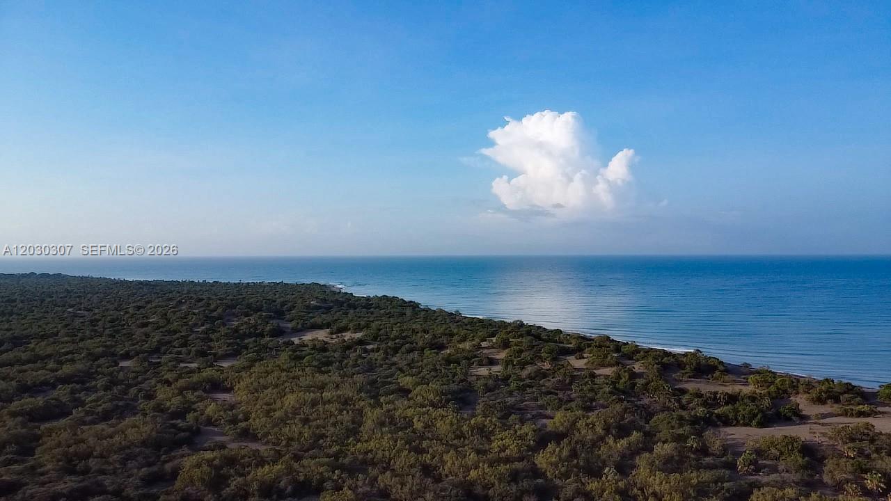 An extraordinary opportunity to acquire approximately 515 acres of unspoiled Caribbean oceanfront land in the Province of Baní, Dominican Republic. This rare coastal holding offers expansive frontage along the Caribbean Sea, combining natural beauty, privacy, and exceptional long-term development potential in one of the Dominican Republic’s emerging coastal regions.

Characterized by open landscapes, coastal breezes, and untouched shoreline, the property presents a unique opportunity for visionary investment and sustainable development. Its location and environmental characteristics make it especially well suited for renewable energy initiatives such as wind or wave energy generation, while also offering tremendous potential for eco-conscious hospitality, wellness retreats, conservation-focused projects, or low-impact ecotourism destinations.

The surrounding region is known for its dramatic coastal scenery, warm climate, and growing infrastructure, while still maintaining an authentic and undeveloped character increasingly difficult to find in Caribbean markets.

Whether envisioned as a private legacy holding, a large-scale ecotourism destination, or an innovative renewable energy project, this remarkable oceanfront acreage offers scale, versatility, and a rare connection to the natural environment of the Caribbean coast.
