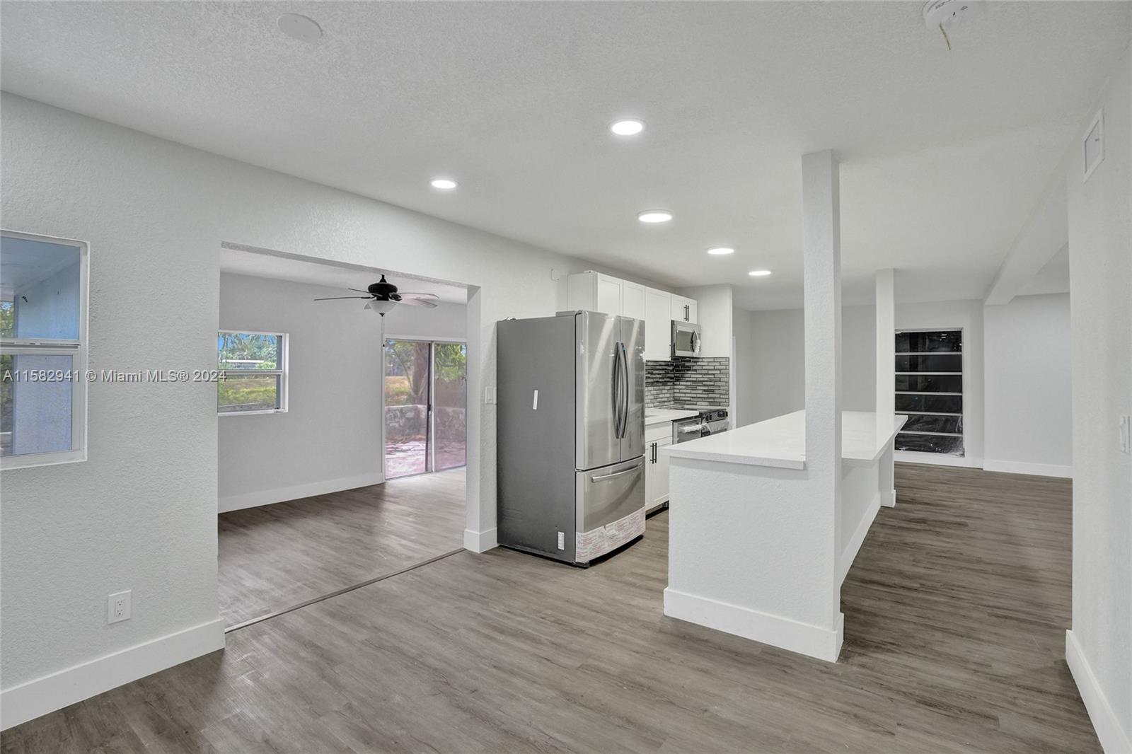 Back on the market! Financing fell through. Beautifully renovated 3/2 plus Florida room in the family friendly town of Tamarac. Large 10,000 square foot lot overlooking water and room for a pool. Association has no approval process and is only $140 per year. New roof, new bathrooms, kitchen, floors and an open layout.