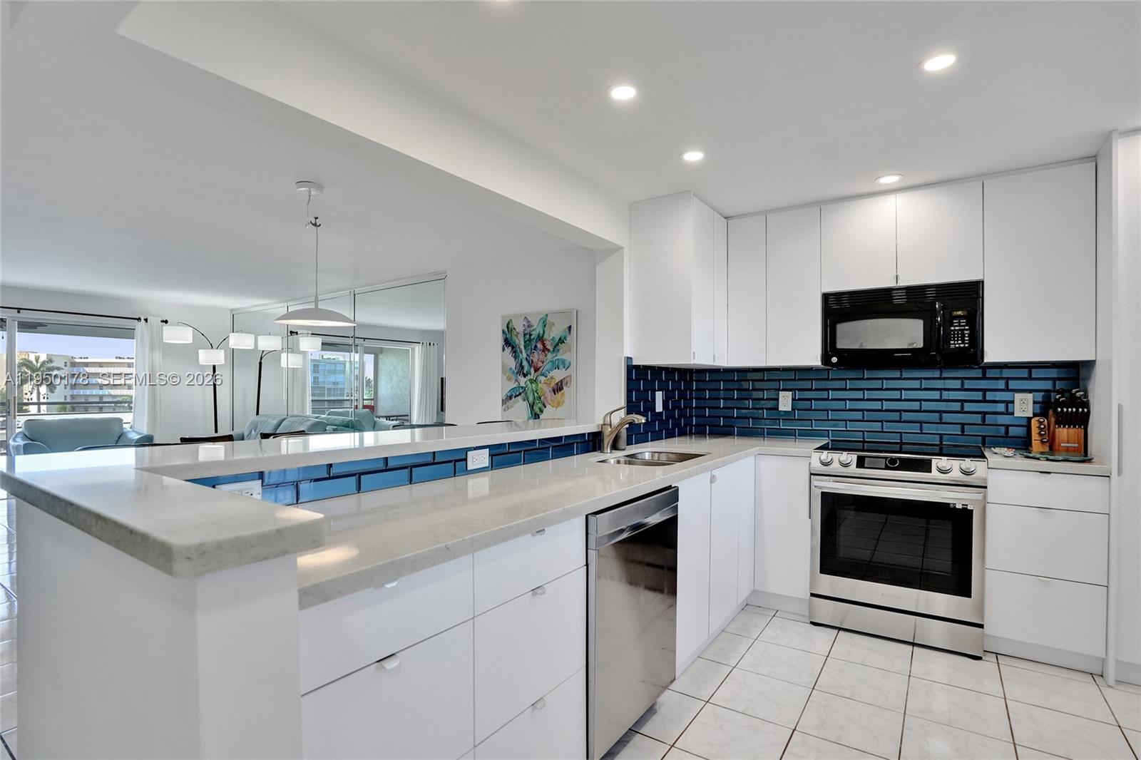 LOCATION LOCATION LOCATION! Beautifully updated 2-bedroom condo decorated in today’s style and fully furnished with high-end furniture. Modern kitchen featuring stainless steel appliances including an air fryer oven, granite countertops, breakfast bar with stools, and recessed lighting. Screened balcony with serene lake views. New A/C, new electrical panel, impact windows, and roll-down shutters on the balcony. Amenities include pool, sauna, and community room. Ideally located close to restaurants, shopping, beach, airport, casino, Dania Pointe, and Oakwood Plaza. Easy to show.