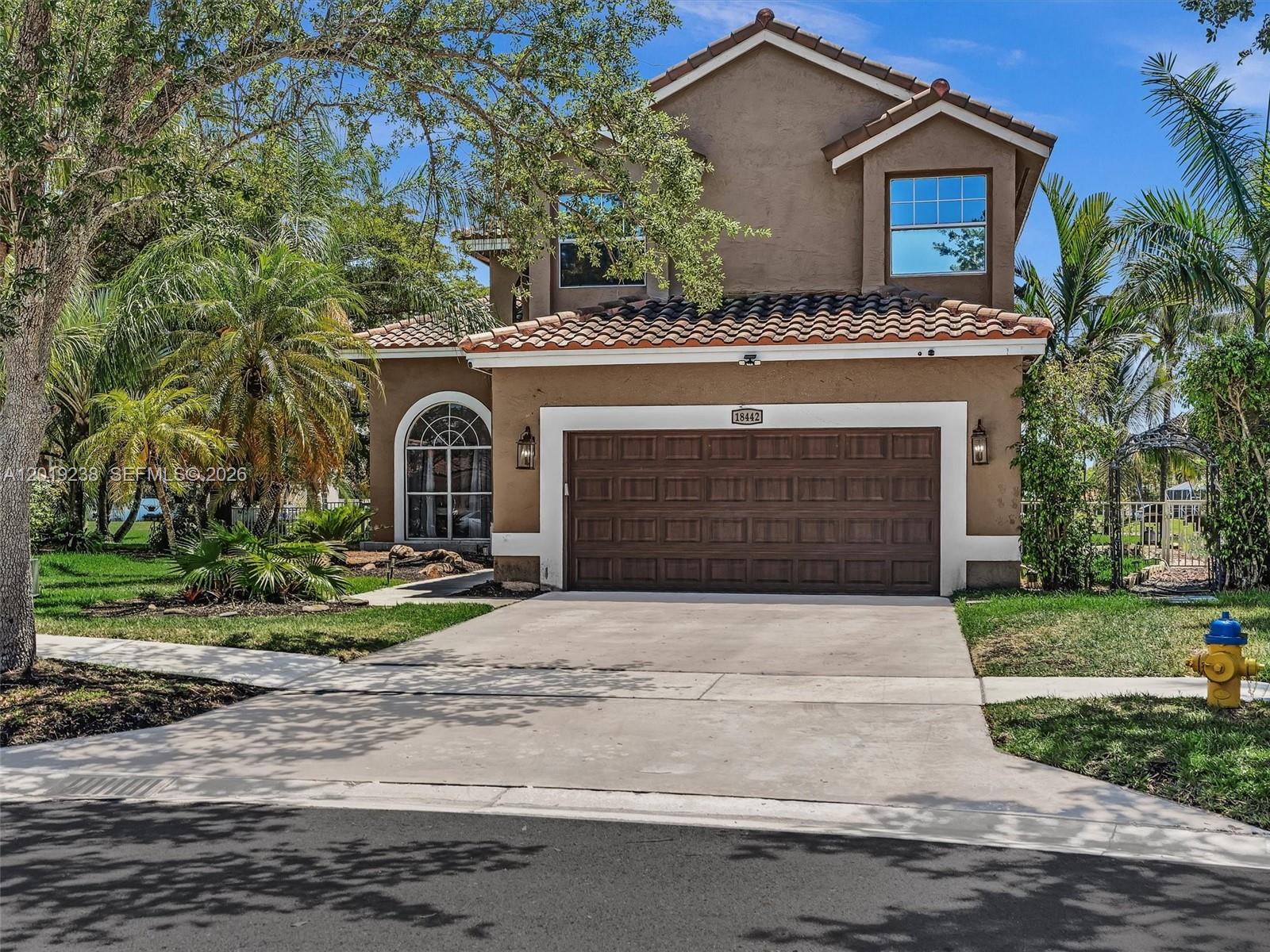 This stunning 5-bedroom, 3-bath lakefront home in the highly desirable Chapel Lake Estates community offers the perfect blend of luxury, comfort, and natural beauty. Situated on a strategically positioned oversized lot, this private retreat features a heated saltwater pool, lush tropical landscaping, a mature mango tree, tranquil waterfall feature, and breathtaking lake views. Inside, the home showcases brand-new porcelain tile flooring installed in 2025, fresh interior paint, updated lighting, hardwood flooring, and impact sliding glass doors that seamlessly connect indoor and outdoor living spaces. The fully remodeled kitchen features elegant quartz countertops, modern cabinetry, and contemporary finishes, while the luxurious primary bathroom was completely renovated in 2025 with a spa-inspired free-standing soaking tub. A convenient first-floor bedroom and full bath provide the ideal setup for guests, in-laws, or a home office. Additional upgrades include a brand-new HVAC system installed in 2025. Zoned for top-rated A+ schools and ideally located near parks, shopping, dining, and the Chapel Trail Nature Preserve, with cable and high-speed internet included. This move-in ready lakefront gem truly has it all.