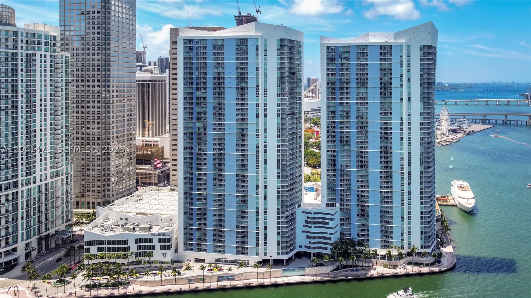 Enjoy breathtaking bay and skyline views from this split plan 2-bed, 2-bath residence at One Miami West, a full-service, resort-style condominium in the southeastern-most tip of Downtown Miami.  Upgrades include real Brazilian wood flooring in living/dining & kitchen areas, luxury vinyl plank flooring in both bedrooms, and marble flooring in balcony.  Unit features Italian kitchen cabinetry, granite countertops, stainless steel appliances, bathroom vanity marble tops, and all impact windows & sliding glass doors. Building has recently undergone several upgrades including biometric elevators for added security, as well as pool improvements that should be ready to enjoy by the end of year.  Comes with 1 covered garage parking space, valet parking available for second vehicle if needed.  Amenities include two pools (One lap, and one lounge pool), fitness center, clubroom, 24-Hr concierge, and waterfront dining. Enjoy smooth connectivity to the Metrorail, Tri-Rail and Brightline via the Metromover, as well as a short walk to Whole Foods, Bayside Marketplace, and downtown & Brickell business and entertainment areas.  Monthly maintenance included basic cable and internet. Special assessment to be paid at closing.