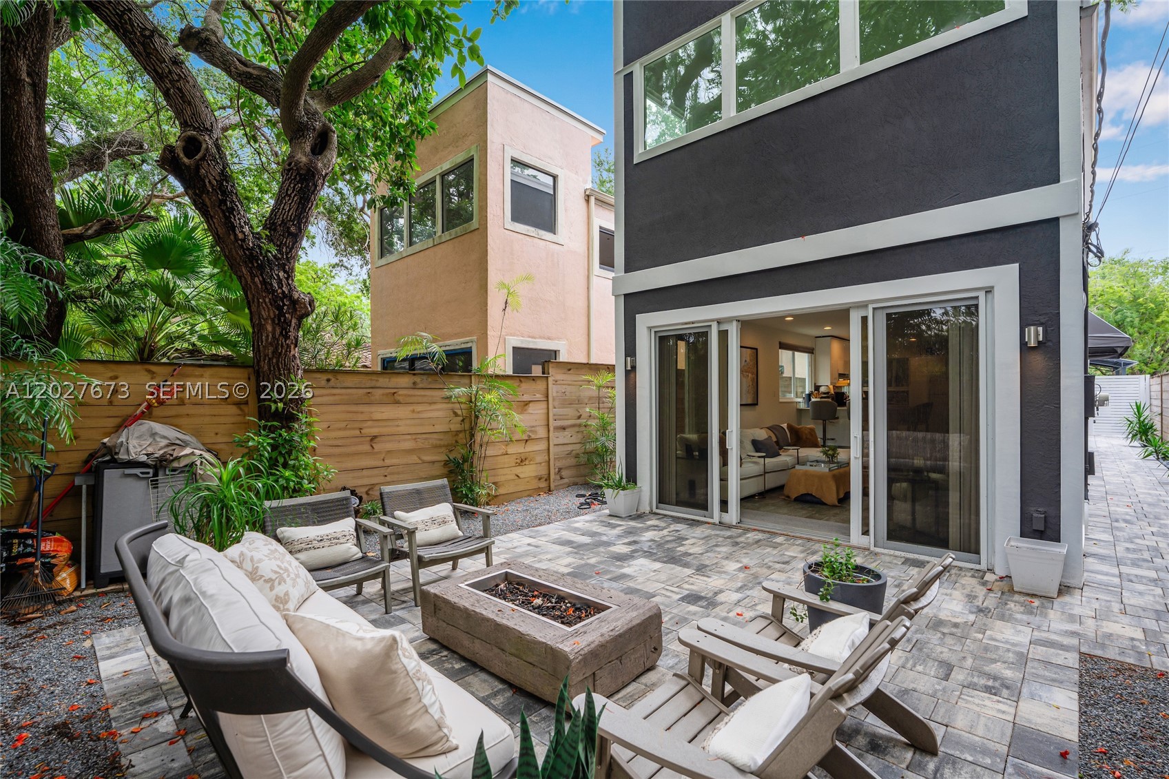 Located within the highly sought-after boundaries of Coconut Grove Elementary School and just a short distance from the school, this beautifully maintained two-story single-family home offers the perfect blend of comfort, style, and location. Featuring 3 bedrooms and 3 bathrooms, this move-in-ready residence has been thoughtfully updated to provide modern convenience while maintaining its warm and inviting character. Located in a no flood zone with impact windows and doors throughout offer peace of mind. The home also includes a new washer and dryer, new a/c, alarm system, and elegant new window treatments. Outside, the property truly shines. A new two-car carport, new outdoor pavers, and a new privacy fence enhance both functionality and curb appeal. The backyard has been transformed into a tranquil Zen-inspired retreat, complete with lush landscaping, and a cozy fire pit area that creates the perfect setting for entertaining guests or enjoying a quiet evening under the stars. Ideally situated within Coconut Grove, and near Coral Gables, with all the parks, restaurants, shopping, and major transportation routes, this exceptional home combines the benefits of a peaceful residential neighborhood with easy access to some of Miami's most desirable destinations. With its extensive upgrades, beautiful outdoor living space, and location within one of Miami's most sought-after school districts, this property presents a rare opportunity to enjoy the very best of south Florida living.