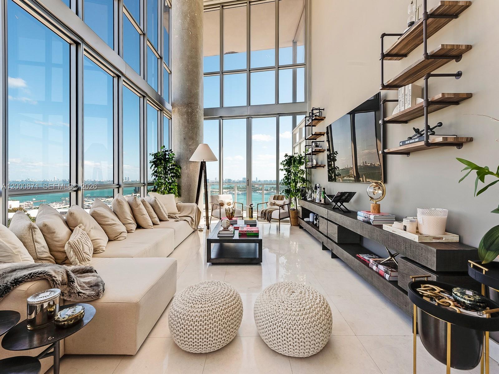 Rarely available residence at The Marquis offering breathtaking bay and ocean views from this desirable line. This spacious two-bedroom plus den features a smart layout, with the den offering a large window that allows it to function comfortably as a third bedroom, office, or flex space. This two-story unit showcases a bright, open living area with floor-to-ceiling windows, a sleek modern kitchen, and a well-appointed primary bath. Enjoy stunning water views from multiple vantage points, creating a true Miami luxury living experience. Located in the sought-after Marquis Residences in Park West, just minutes from Museum Park, Bayside, Brickell, Midtown, and South Beach. Full-service amenities include 24-hour lobby security, resort-style pools, spa, fitness center, sauna, and more.