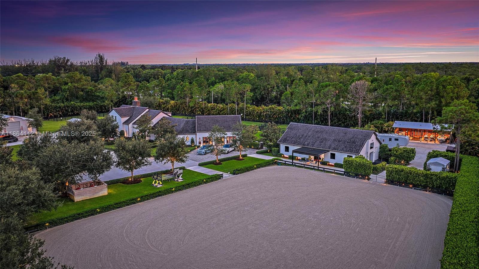 This completely reimagined estate combines timeless charm with modern luxury on 5 private acres in Palm Beach Gardens' coveted equestrian community of Caloosa. Designed as a full retreat, it offers open, sun-filled living spaces and resort quality amenities inside and out.

Walls of windows frame the flowing layout, connecting the designer kitchen, dining area, and inviting living spaces. The primary suite features a morning bar, custom wardrobe closets, and a spa-style bath. Multiple guest suites and a luxury in-home cinema provide space for everyone to unwind.

A fully automated Control4 smart home system with Josh AI manages lighting, climate, entertainment, and security, delivering convenience to match the estate's beauty. Every detail has already been thought through - even