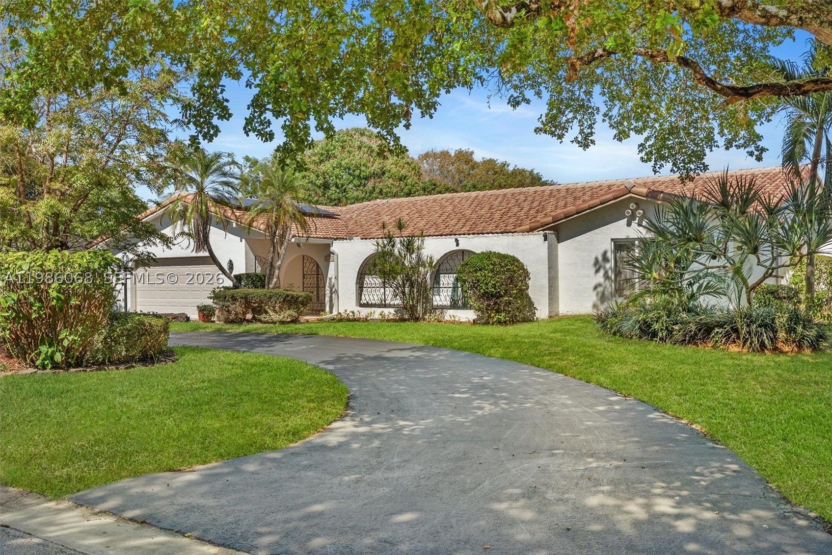 $50,000.00 PRICE REDUCTION!!!  Schedule to see this home TODAY!  An energy-independent retreat on a quiet dead-end street in the Country Club of Coral Springs, offering private resort-style living with no HOA or mandatory membership. A fully paid 16.77 kWp solar system covers all electricity needs, eliminating power bills, while solar water heating and a private irrigation well further reduce costs. Includes a 220V EV outlet and separate A/C for the primary suite.  Inside, enjoy granite countertops, a center island, Jenn Air grill, and walk-in pantry. Finishes include oversized tile, engineered hardwood, and marble bathrooms. Solar tubes provide natural light, and a central vacuum adds convenience.  The highlight is the expansive 35.9' x 14.8' pool with an energy-efficient pump, perfect for relaxing or entertaining while taking in stunning sunset views over the private golf course. The property also features a fruit orchard with avocado, mango, and banana trees, plus an included electric golf cart.  Additional amenities include clubhouse access, fitness center, pro shop, pickleball courts, and a bar/grill, along with homeowner only walking privileges on the course during off peak times.  A New Tile Roof and full Impact Windows and Doors for your peace of mind. Close to top-tier schools like Parkside Elementary and Coral Glades High, as well as premier shopping nearby. Metal Hurricane shutters and pool safety fencing are in the garage and will stay with the home.