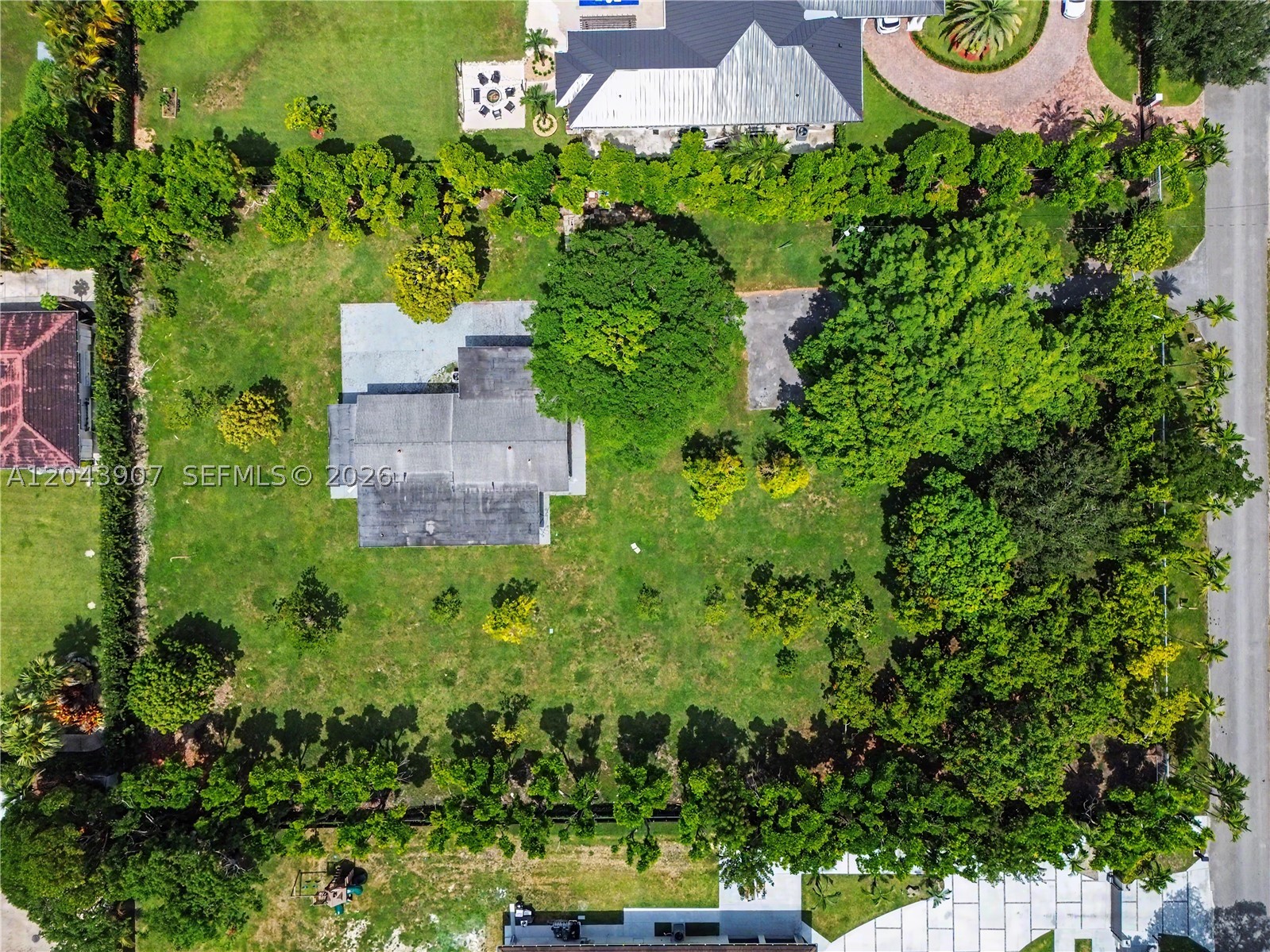 Rare opportunity to own over 1.3 acres in the heart of Miami! Situated on an expansive 56,715 SF agricultural-zoned lot, this unique property offers endless potential to build the custom estate of your dreams. The existing 3-bedroom, 2-bath residence features approximately 2,083 SF of living area and requires substantial renovations or tear down, making it ideal for redevelopment or a complete rebuild. Surrounded by beautiful custom homes, this oversized homesite provides exceptional privacy while remaining centrally located East of the Florida Turnpike and just minutes from top-rated schools, premier shopping, dining, hospitals, and Miami International Airport. Whether you envision a luxury estate, family compound, or private retreat with room for a guest house, pool, gardens, recreational vehicles, or equestrian-inspired amenities, the possibilities are endless. Properties of this size and location are becoming increasingly rare in Miami-Dade County. Don't miss this exceptional opportunity to secure one of the area's most desirable oversized homesites and create a legacy property in a highly sought-after location.