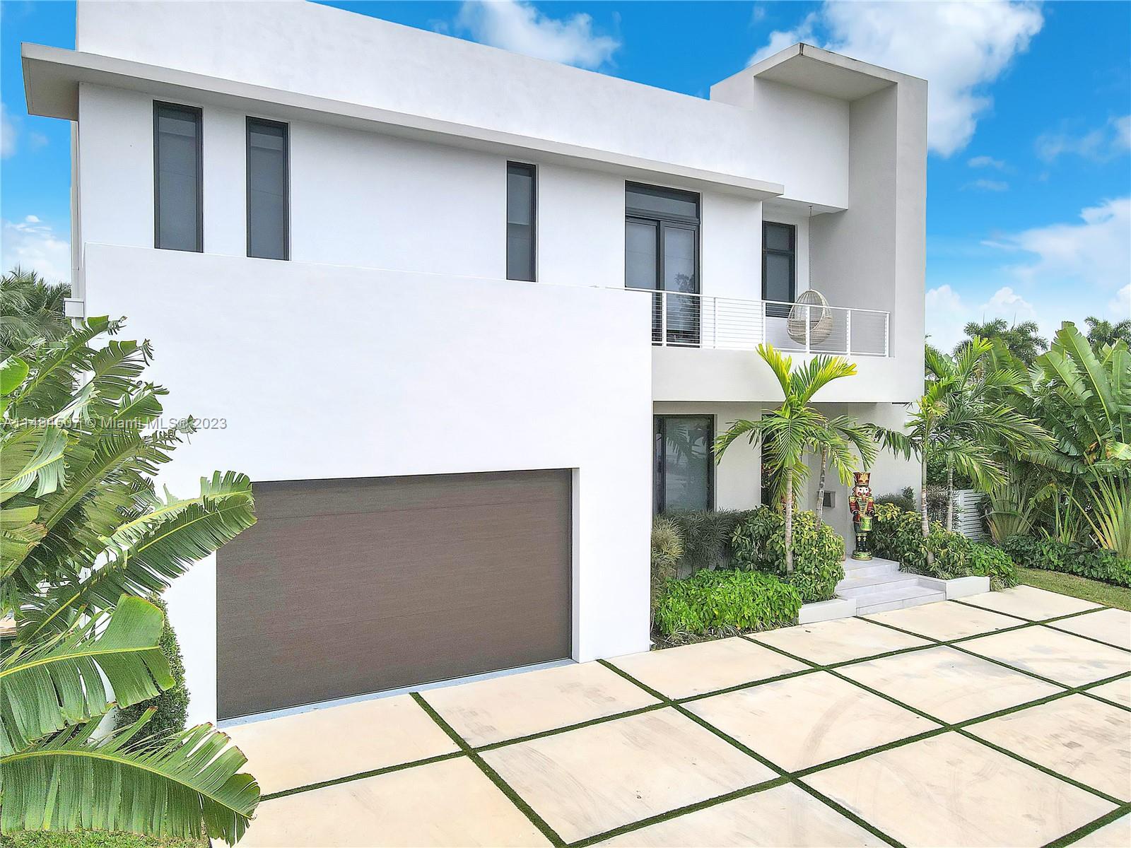 Indulge in luxury waterfront living in this 2021 new construction home on exclusive Keystone Island. With 5 bedrooms and 5 bathrooms, this home boasts high ceilings, creating an elegant and spacious atmosphere. Enjoy direct water access with a 60ft dock and a 2-year-old boat lift ensuring your vessel is secure. The property also offers the option to purchase a boat.

The impressive backyard features a large playhouse and a spacious area with a pool and half basketball court. This residence seamlessly combines modern design, family-friendly features, and a prime waterfront location. Embrace the unique opportunity to own a piece of exclusive waterfront living in one of Miami's most coveted neighborhoods. Your dream home with a perfect blend of sophistication and recreation awaits.