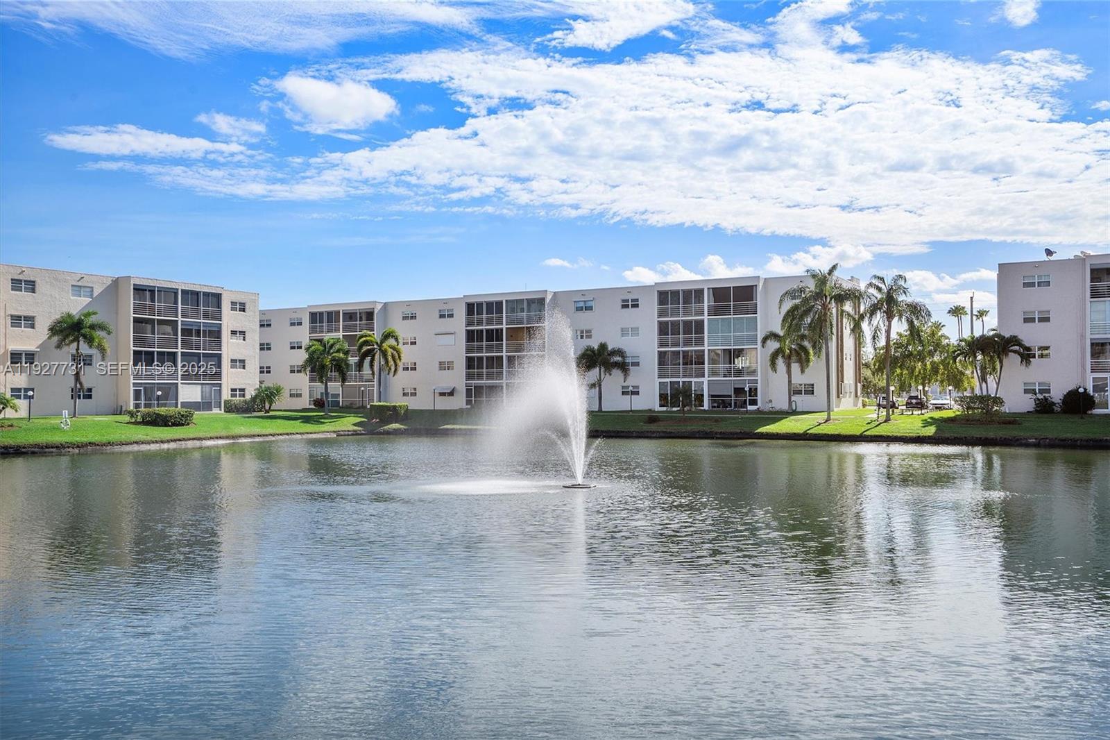 Peaceful lakefront living awaits in this beautiful condo featuring a screened balcony overlooking a tranquil lake and fountain—perfect for morning coffee or evening relaxation. The home offers abundant closet space plus additional storage, all within a clean, quiet, and lovingly maintained community. Major improvements have already been completed, including the roof, elevator, parking lot, and fresh exterior paint, providing true peace of mind. The 40-year inspection is complete. Ideally located just minutes from the beach, casinos, shopping, golf, tennis, kayaking, marinas, the famous Hollywood Broadwalk, and air & sea ports. Enjoy an active yet peaceful lifestyle with beautifully walkable sidewalks for daily strolls or jogging. Leasing is not permitted. At least one owner/occupant must be 55+, and no residents under 16 are allowed.