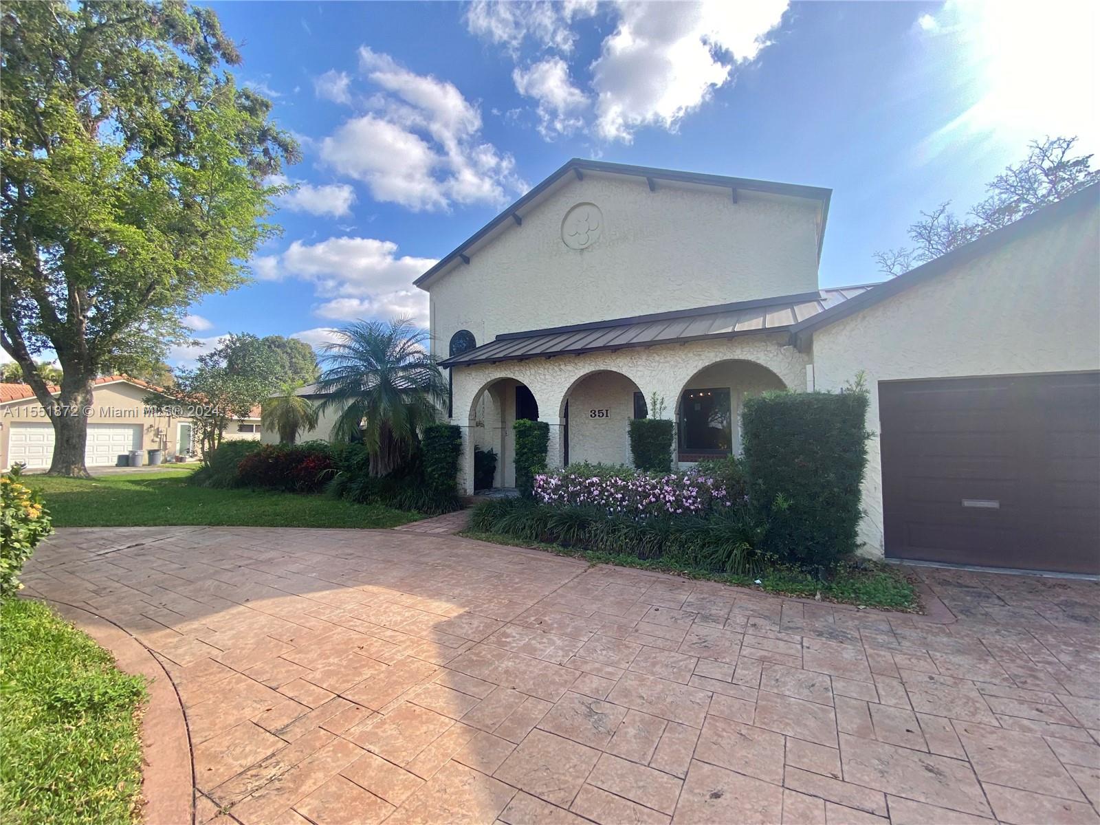 Step into this lakefront dream home, a canvas waiting for your personal touch. With new floors, new metal roof, and new impact windows and doors throughout, the foundation is set for your vision to unfold. The owner of this lakefront paradise has dropped the price substantially enabling the buyer to craft their dream kitchen and complete the remodeling to their taste.  Bathrooms have been meticulously remodeled, awaiting the installation of your chosen vanities. Embrace the chance to transform this already beautiful space into your own lakeside haven. Both Bedrooms upstairs have rooftop terraces with breathtaking views of the tranquil lake and inviting pool. Truly a must see!
