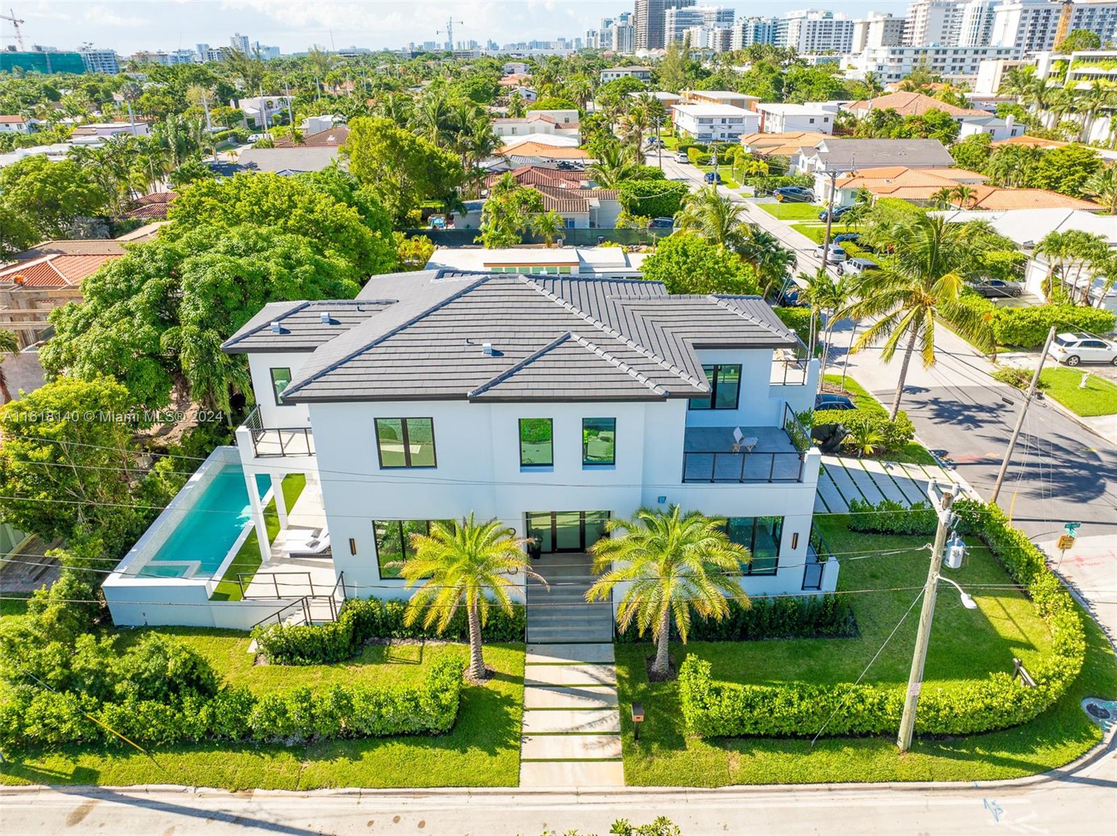 Brand New Construction! Fully Completed and Move-In Ready! This gorgeous 6BR/6BA home on a prime corner lot is a top-quality home for the discerning buyer. Boasting 2 stories of impeccably-appointed living space, a large covered patio, private balconies off the BR's & sparkling 35 ft pool & Jacuzzi, this gem is brand new & one of a kind. Every inch of the luxurious interiors has been thoughtfully designed w/utmost attention to detail. 11-12 foot ceilings, oversized windows, exquisite flooring, chic lighting & premium materials exude modern elegance. The layout is a dream w/ a dramatic great rm for entertaining, formal dining, Hi-End eat-in kitchen w/Wolf appliances, den/office & more! Short distance from Surfside Community Center, Tennis Courts, places of worship, Shopping & Beach!