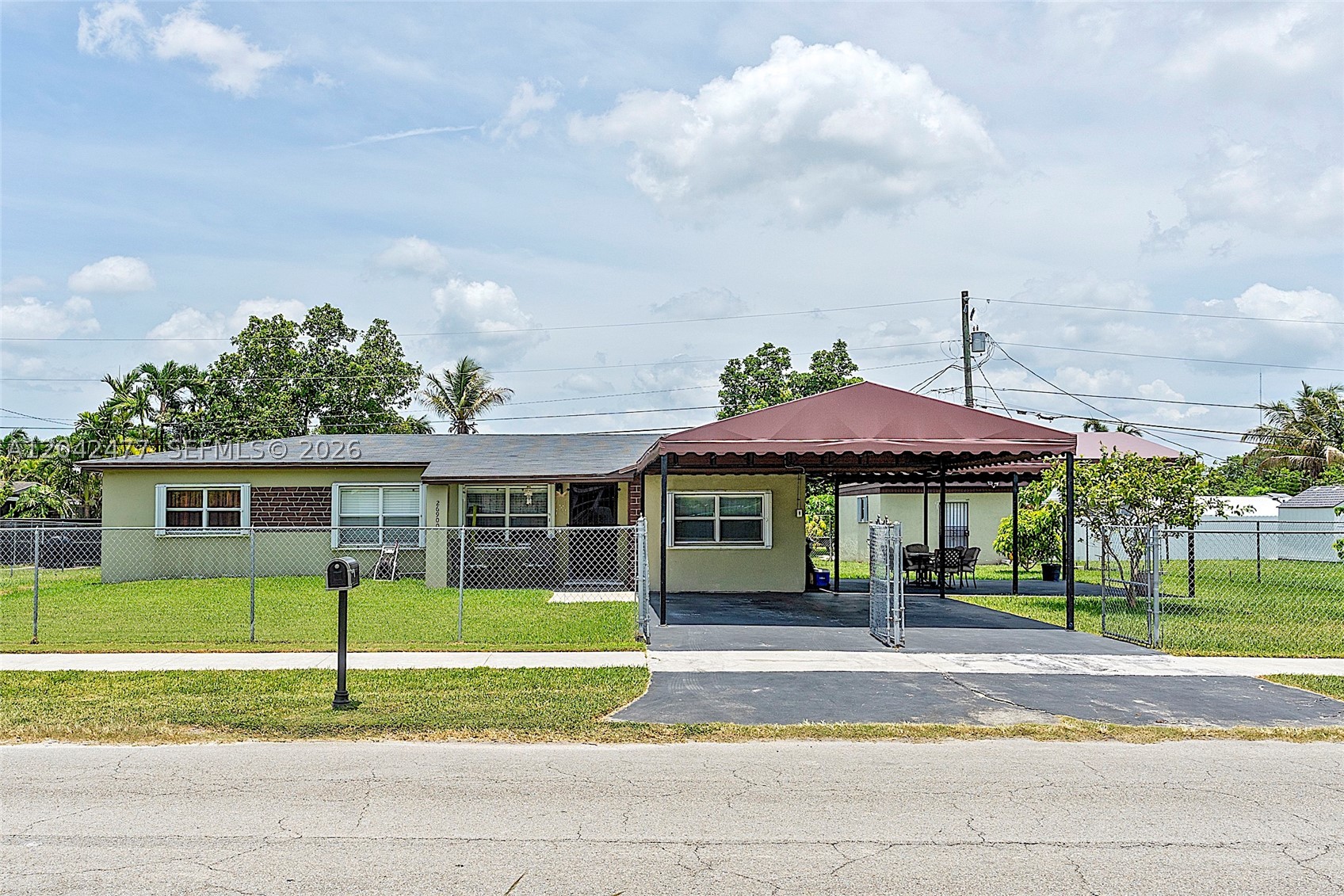 Welcome to this exceptionally spacious, pleasant 3-bedroom, 1-bathroom home featuring an additional private 1-bedroom, 1-bathroom guest room and a versatile den (office/craft room). Upgraded for peace of mind with accordion shutters, a 2-month-old AC, and a new water heater installed in February of 2026. The 0.23-acre lot boasts fruit trees and 2 large sheds (one with a washer/dryer installation). Located in a quiet, highly convenient neighborhood close to major supermarkets, shopping hubs, and expressway access.