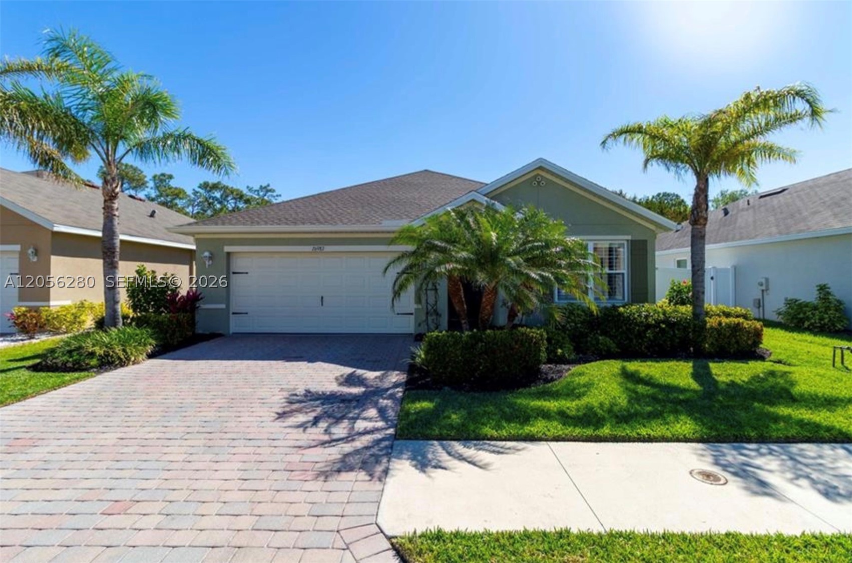 A PRIVATE BRICK PAVER PATIO framed by mature shade trees and FULLY FENCED for privacy is just the beginning of what makes this Bonita Springs rental stand out. Step outside to a backyard that actually lives — quiet, landscaped, and ready for evenings with nowhere to be. Inside, the home is thoughtfully maintained and move-in ready. The kitchen is the anchor of the main living space — RAISED-PANEL CABINETRY with crown molding details, GRANITE COUNTERTOPS, a large KITCHEN ISLAND with bar seating, STONE TILE BACKSPLASH, and a full suite of STAINLESS STEEL APPLIANCES, all dressed with wrought iron pendant lighting that sets the tone. The open layout flows naturally into the dining area and main living room, where PLANTATION SHUTTERS, CROWN MOLDING, and TILE FLOORING carry through every room. Three bedrooms each offer WOOD-LOOK FLOORING, PLANTATION SHUTTERS, and ceiling fans — the primary suite featuring its own private bath with a glass-enclosed walk-in shower. The two-car garage and BRICK PAVER DRIVEWAY round out a curb appeal that turns heads in the neighborhood. Landscaping, high-speed internet, and pest control are all included. Pets welcome. Located in one of Bonita Springs' most established residential corridors — minutes from pristine beaches, premier dining, and the best Southwest Florida has to offer.
