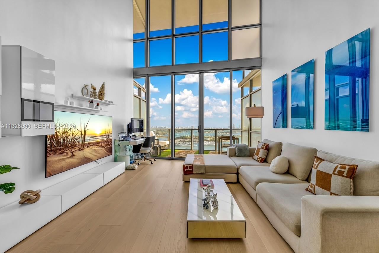 The Ultimate Miami Loft — Perched high on the 43rd floor of Marquis, this one-of-a-kind residence offers unobstructed turquoise water views of Biscayne Bay, the Atlantic Ocean, Miami Beach, and Downtown Miami. Spanning nearly 1,700 SF of fully renovated interior space, this 1-bedroom + DEN features soaring 20' ceilings, floor-to-ceiling windows, an oversized terrace, and abundant storage throughout. No detail was overlooked—brand-new kitchen, bathrooms, flooring, and accent lighting elevate the space. Enjoy 5-star amenities including pools, fitness center and spa, 24-hour security, and exclusive beach club access at the Bentley Hotel in South Beach. Live in the heart of it all—steps from the waterfront park, art and science museums, Arena, Miami Worldcenter, and the future 33-acre park.