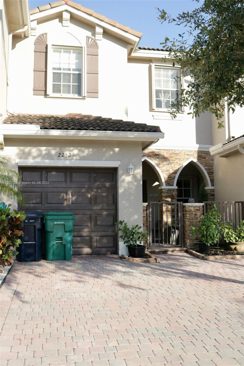 Beautiful 3/2.5 Townhouse with Garage inside Isles of Bayshore in Cutler Bay. The home features a 1/2 bath and commercial grade vinyl floors throughout the downstairs and laminate wood upstairs. Modern kitchen with stainless steel appliances, granite counter tops and wood cabinets perfect for entertaining. Upstairs you will find a spacious master bedroom with large bathroom and walk in closet, washer and dryer and full bathrooms. This spacious townhouse is located within a community that has Children's Playground, Fitness Center, Walking Trails and Resort-Like Pool. Cutler Bay offers Shopping Centers, Eating Establishments with Outdoor Entertainment and community events. It includes a private yard, no neighbors behind fenced patio. Move in ready home.