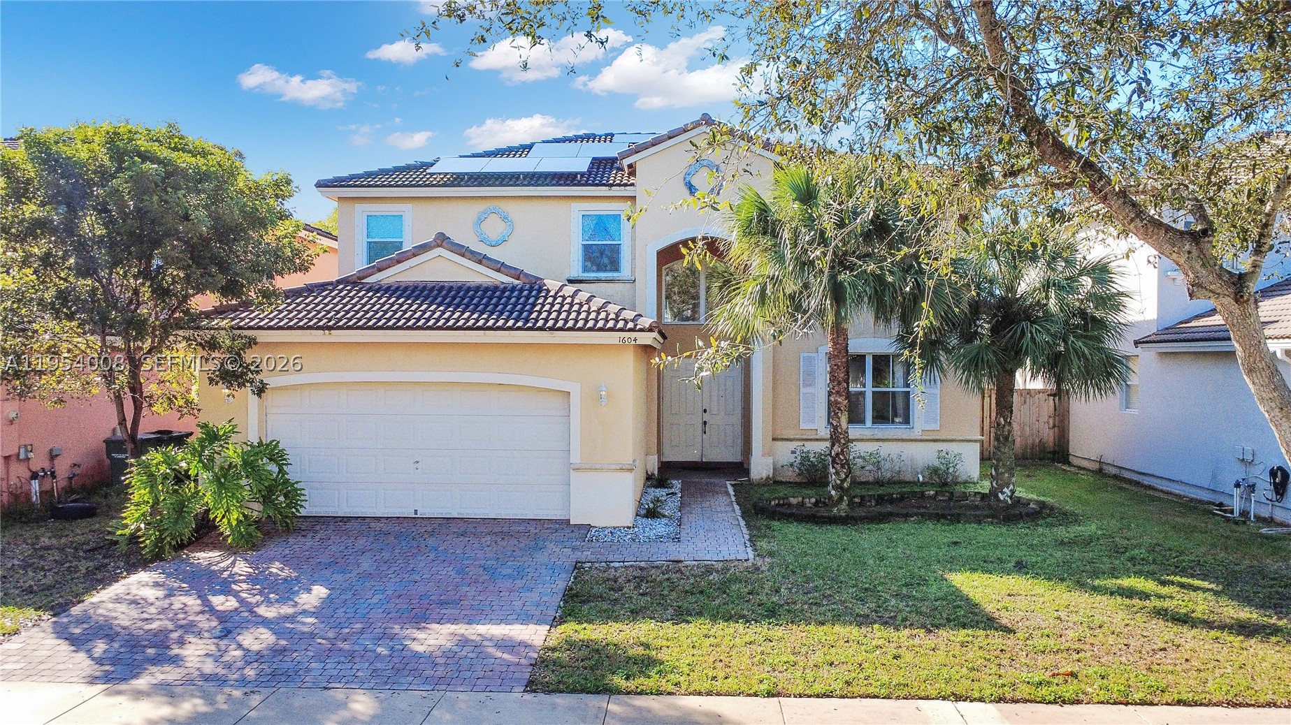 MOTIVATED SELLER!! Two-story home in Keys Landing featuring 4 bedrooms and 3 full baths, including a desirable ground-level suite—ideal for multigenerational living, guests, or added privacy. The open-concept layout offers spacious living areas and a modern kitchen equipped with stainless steel appliances and a wet bar, perfect for entertaining. The private primary suite features dual walk-in closets, a soaking tub, and separate shower. Situated on a 5,971 Sq.Ft. lot with room for a pool, this home is also a perfect fit for retirees or as a second home getaway in South Florida. 

Enjoy energy efficiency with paid-off solar panels keeping electric costs low (approximately $75/month). Additional features include impact windows upstairs, storm panels downstairs, a 2-car garage, and dedicated laundry room. HOA includes internet and cable. Conveniently located near parks, schools, shopping, dining, and the Turnpike. FHA and VA approved!