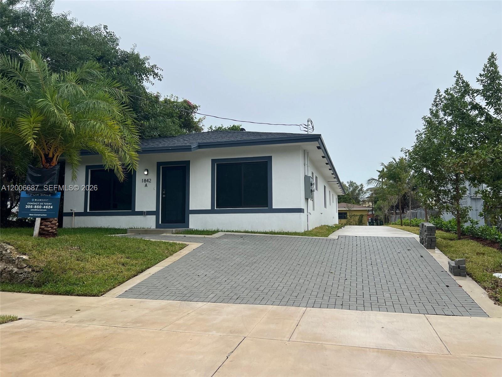 New construction twin home in the heart of Miami featuring modern design and quality CBS poured-on-site construction. This residence offers impact-resistant windows, and a thoughtfully designed layout with a 2-car driveway finished in pavers and concrete. Located in a desirable central Miami area with easy access to major highways, schools, and urban amenities. Property is part of a workforce program. CO received. Built by Bluenest Development. Move-in ready and available for immediate occupancy.
