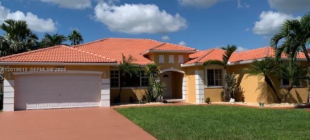 NO HOA, A real gem! Rare Mediterranean-style home situated on a 9,000+ sq ft lot. Priced to sell fast. One of only two blocks in the entire area featuring these highly sought-after homes. Spacious 4/2.5 built in 2004 and move in ready. Excellent condition with numerous updates including A/C, ducts, gutters, roof, floors, bathrooms, shower, entry doors and garage. A true South Florida luxury-style feel with exceptional curb appeal. -- Don't miss this one! *some pictures have been enhanced.