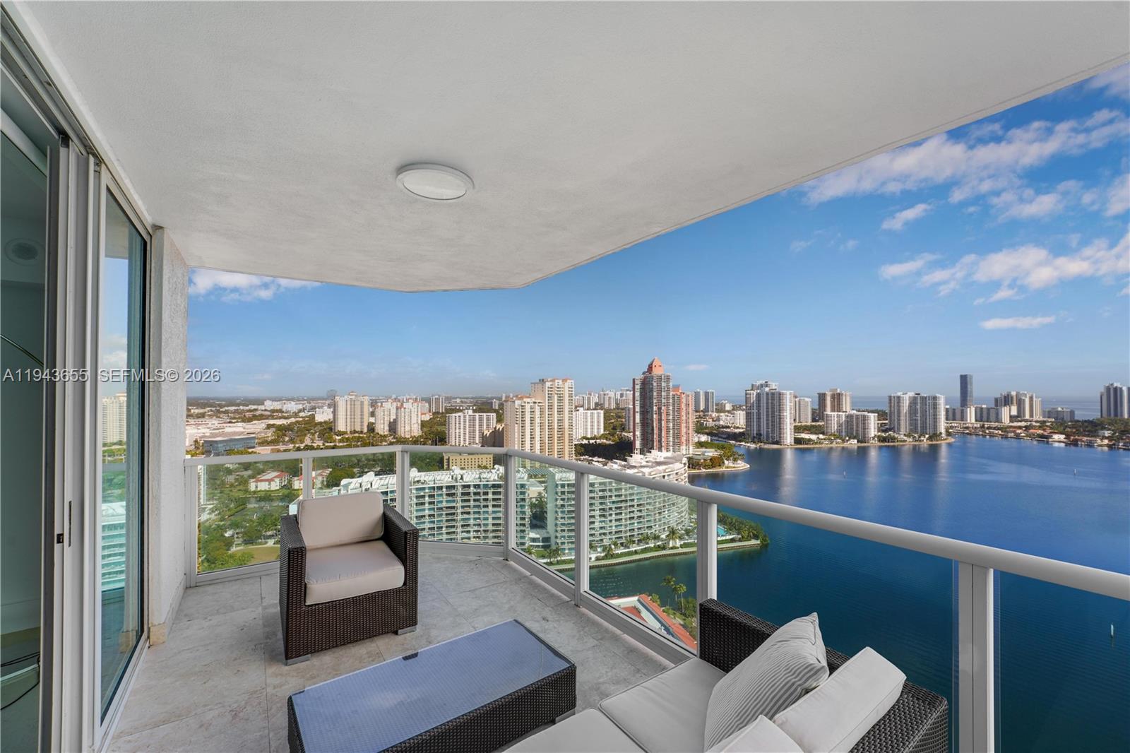 Experience the pinnacle of luxury living in this fully renovated Peninsula II corner penthouse. This expansive flow-through residence offers breathtaking east and west exposures, allowing for sunrise and sunset views, with water views from every angle. Spanning approximately 3,533 sq ft, this 4-bedroom, 4.5-bath home features three balconies and is offered fully furnished, including high-end electronics and curated artwork. Peninsula II offers world-class amenities including 24-hour security and concierge, resort-style pool and spa, two fitness centers, sauna and steam rooms, tennis and pickleball courts, children’s playroom, on-site cafeteria, BBQ and lounge areas, and complimentary valet service. A truly turnkey opportunity for discerning buyers.