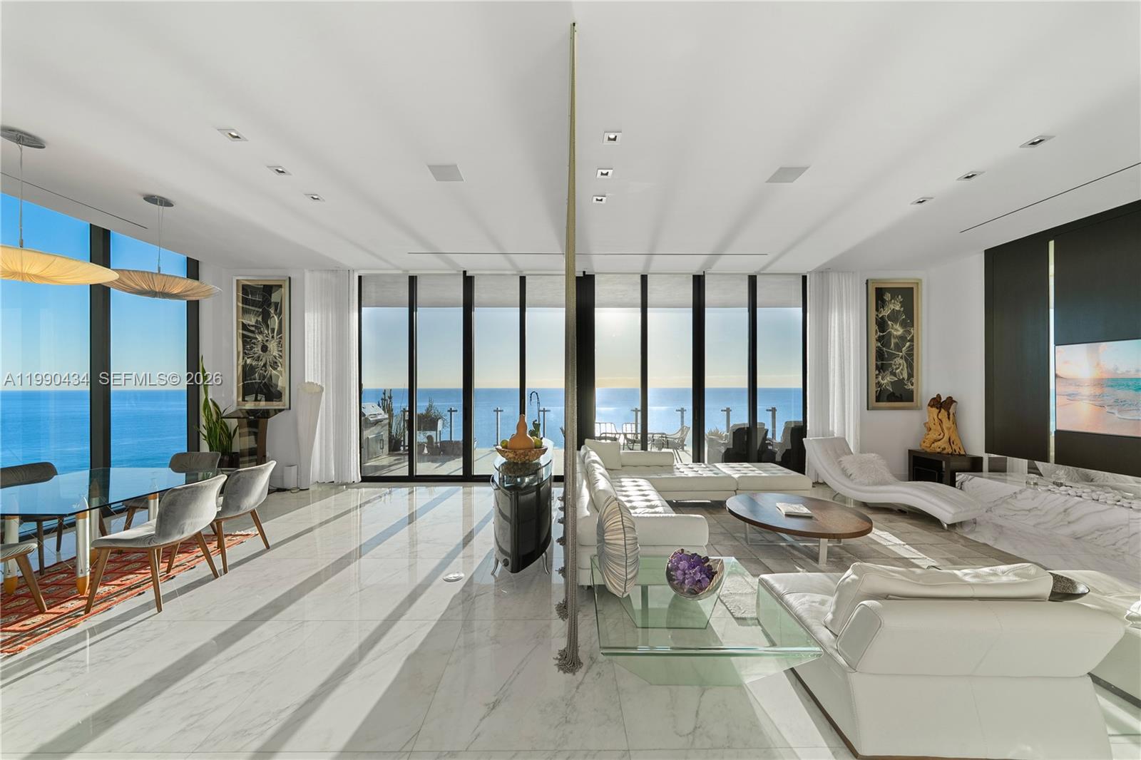 THE EPITOME OF BOUTIQUE BEACHFRONT LIVING AT MUSE IN SUNNY ISLES BEACH WITH UNOBSTRUCTED SUNRISE VIEWS! An architectural masterpiece by renowned designer Carlos Ott in collaboration with Sieger Suarez Architects & interiors by Allison Antrobus. This 3,195 SF residence features 3 Bedrooms, 3.5 Bathrooms + Den, offering a seamless blend of contemporary design, privacy & breathtaking ocean views. Enter through your private elevator foyer into expansive living spaces wrapped in floor-to-ceiling glass, filling the home with natural light. The gourmet kitchen showcases top-of-the-line Sub-Zero & Wolf appliances, sleek cabinetry, and refined finishes throughout. The primary suite enjoys direct sunrise & ocean views, complemented by a dressing room and a marble-clad primary bath with a soaking tub and separate shower. MUSE delivers an intimate, full-service lifestyle with premier amenities, including a resort-style pool and spa, state-of-the-art fitness center, on-site dining, and 24/7 concierge, valet, and security services. A rare opportunity to own in one of Sunny Isles Beach’s most exclusive oceanfront addresses.
