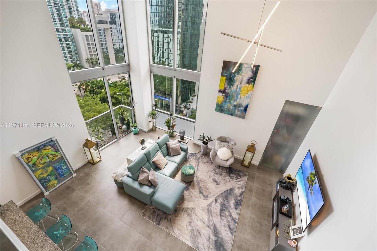 Welcome to the only true double-height loft currently available in 1060 Brickell — and one of the most unique residences in all of Brickell.

This 2-bedroom, 2-bath corner unit features soaring 20-foot ceilings and dramatic floor-to-ceiling glass, creating a level of volume, light, and architectural presence that simply doesn’t exist in traditional condo layouts.

Positioned on the highest floor for this loft line, the residence captures sweeping north- and east-facing skyline views, delivering natural light throughout the day and stunning city views at night.

With over 1,400 square feet, the open-concept layout offers a rare sense of space, seamlessly connecting the living, dining, and kitchen areas — ideal for both everyday living and entertaining. The modern Italian-style kitchen is equipped with sleek cabinetry, stone countertops, and stainless steel appliances.

Step out onto your private balcony and experience the energy of Brickell from above — a true urban retreat.

Located just steps from Brickell City Centre and Mary Brickell Village, you’re surrounded by world-class dining, shopping, and nightlife, with easy access to major highways and the MetroMover.

All remaining assessments will be paid at closing.