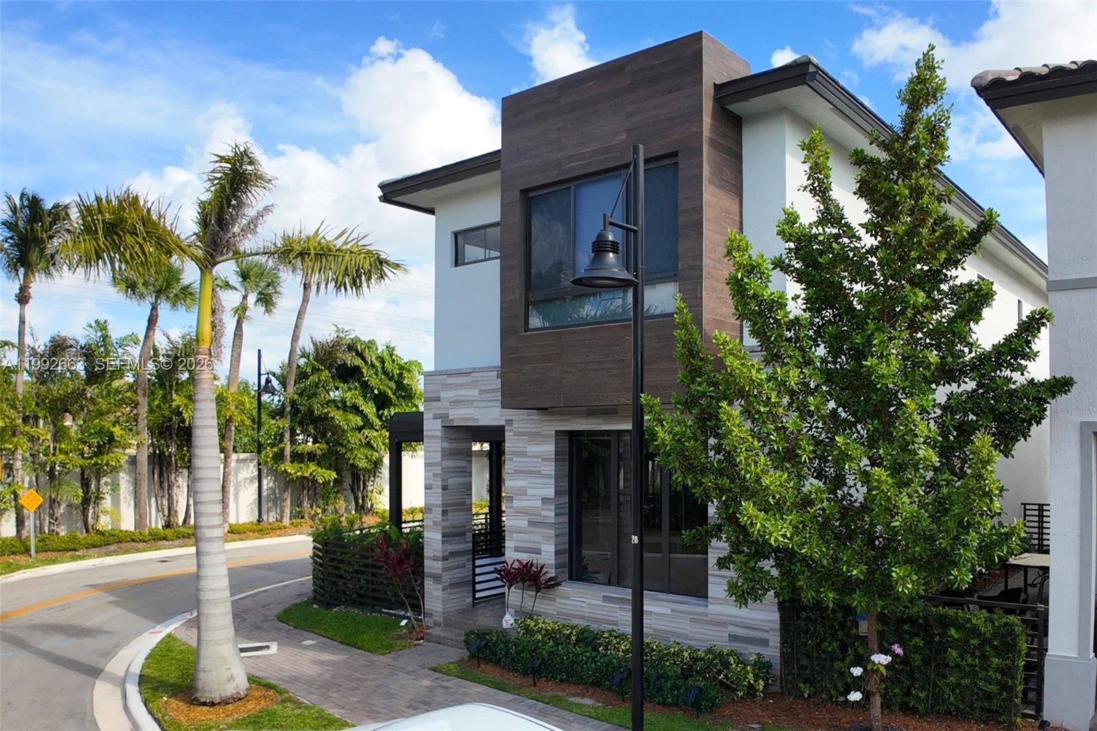 Built in 2023, this corner-lot residence in Doral delivers a rare combination of privacy, efficiency, and elevated everyday living. Set on a low-traffic street, the home offers a bright, modern layout with upgraded flooring, custom motorized blinds, and a refined Italian-style kitchen featuring premium cabinetry and upgraded countertops. Solar panels provide meaningful energy efficiency and long-term savings.

Outdoor living is designed for effortless enjoyment, with a newly finished patio, pergola, and fully equipped BBQ area including grill, griddle, wine cooler, and ice maker, creating a seamless indoor-outdoor lifestyle. The garage is enhanced with slat-wall storage, workspace, and bike lift. All bedrooms feature en-suite baths, while the primary suite includes dual walk-in closets.

A standout feature in this community: parking for four vehicles (two-car garage plus two additional paver spaces), a true rarity. Located just steps from CityPlace, Downtown Doral, top schools, dining, and cultural venues, this home offers a daily lifestyle that is both relaxed and refined, setting it apart from anything else in the neighborhood.