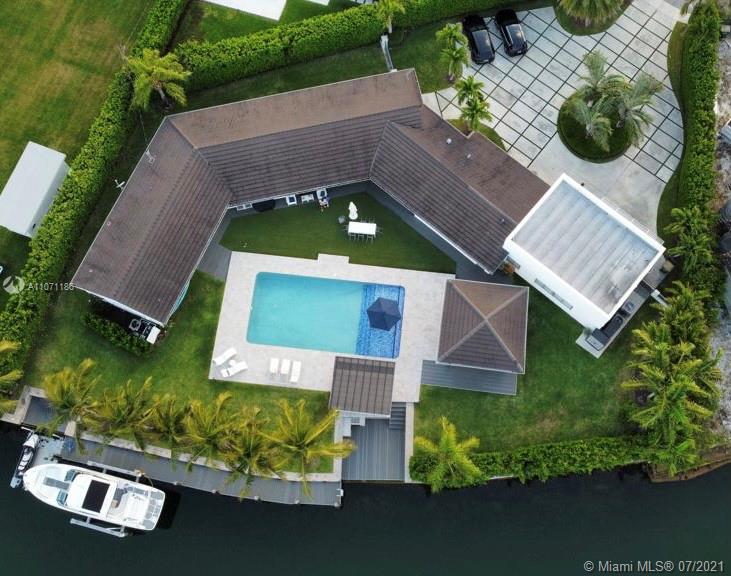 Waterfront living! Astonishing, recently remodeled on 22,328SF unique Lot, surrounded by Clusia plants for privacy/175 Ft on the Water/70SF dock/Jet skies dock/Boat lift/Fish Cleaning area. Very private Tropical setting surrounds Gazebo with Tv,Summer Kitchen,Bar area, surround speaker systems,20x40 heated pool w/saline chlorination sys.,Outdoor shower.With 4,004 SF, 4beds/4 baths (+a room easily to be converted as the 5th bed),the house contains a beautiful open kitchen with island,Sub-zero fridge, freezer, wine cooler, ice maker, BOSCH Appliances.Hurricane windows and doors.Side yard with enough area to park a trailer.The drive way provides enough space to park 8+cars.Addition to the house, was concrete designed for stairs and roof top sundeck. Ethernet & cable connections in every room.
