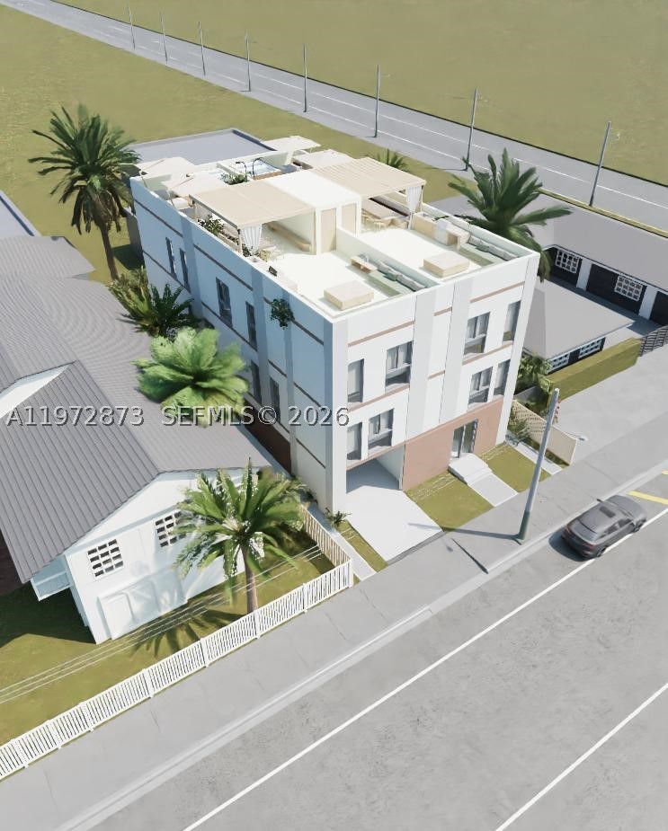 Welcome to The MiMo 62nd Sky Collection, two exclusive residences in the heart of the MiMo District. This freestanding luxury property features two side-by-side, three-story homes each with a private pool & rooftop terrace. Each residence offers 4 bedrooms & 4.5 bathrooms, seamlessly blending the scale of a single-family home with the sophistication of a modern, design-forward build. The first level is dedicated to entertaining, highlighted by 22-foot ceilings, an expansive lounge & direct access to a private ground-floor pool. The second level unveils an open-concept living & dining space centered around a chef’s kitchen featuring custom European cabinetry, an oversized eat-in island, and Fisher & Paykel appliances. A seamless blend of light and scale defines the interiors, with floor-to-ceiling windows and soaring ceilings throughout, complemented by bespoke finishes and custom-designed doors that elevate every space. The third level is anchored by the primary suite thoughtfully appointed with a spa-inspired bath featuring a two-person shower, soaking tub and an expansive custom walk-in closet. Two additional bedrooms, each with en-suite baths and tailored closet systems, complete the upper level. The rooftop terraces offer the ultimate in outdoor living, designed for customization with endless upgrade options. The residences share a secured entry lobby & a private garage with direct access to each home. Ready for delivery, schedule your tour today.