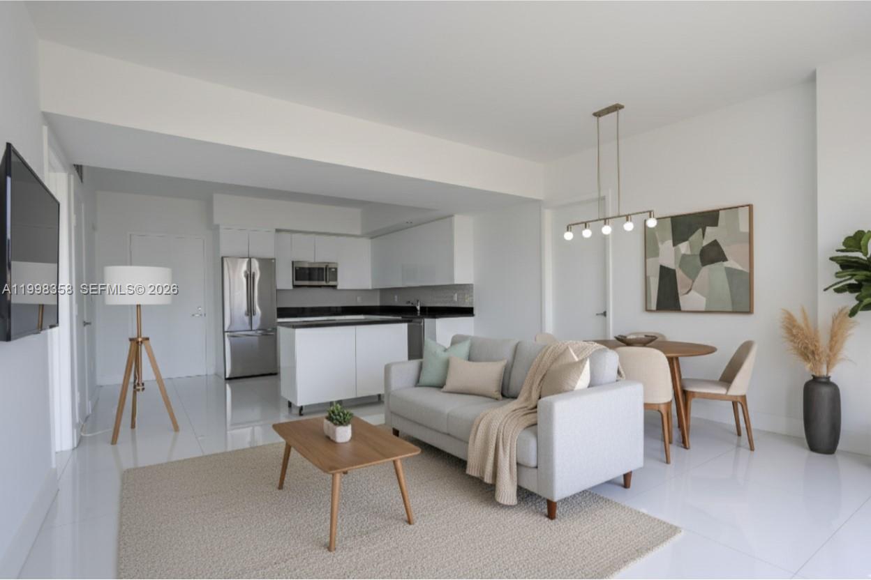 Spectacular 2-bedroom, 2-bathroom apartment in Mint, on the 35th floor, with views of the Miami River, Brickell, and Brickell City Centre. The split floor plan features a sleek black kitchen against a modern white backdrop; a virtual rendering has been added to showcase its potential. The owner is offering $10,000 in credit toward design, furnishings, or closing costs. This luxury building boasts an impressive lobby, fitness center, swimming pools, and a children's play area. Ideally located with easy access to Downtown and Brickell. Adjacent to the building, the new Faena project will transform the entrance, bringing exclusive restaurants and shops, making this residence a unique investment and an unparalleled lifestyle.