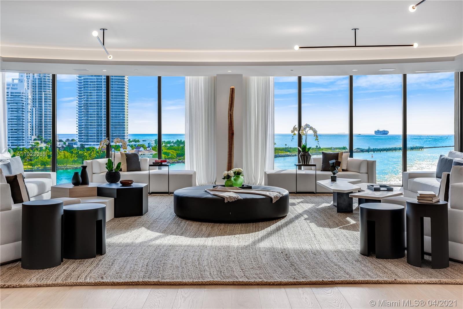 Live in Fisher Island’s newest & best full-service building in this exquisite brand new 5 bd breathtaking estate. Sold fully furnished by renowned interior designer Sam Robin, truly a one-of-a-kind masterpiece. Enter through a private elevator entry to extraordinary views of the Ocean, South Beach, Fisher Island & Downtown Miami. You are greeted by wide-plank natural European Oak wood flooring throughout, 10ft floor-to-ceiling windows, views from every room, an open layout gourmet kitchen by BOFFI w/Miele appliances & SubZero Refrigeration + Wine Cooler, throughout you will find white lacquer Italian Lualdi doors. The principal suite fit for royalty features a BOFFI master bath w/BookMatched Marble, custom floating tub & the walk in closet of your dreams. Enjoy 6-Star service & amenities.