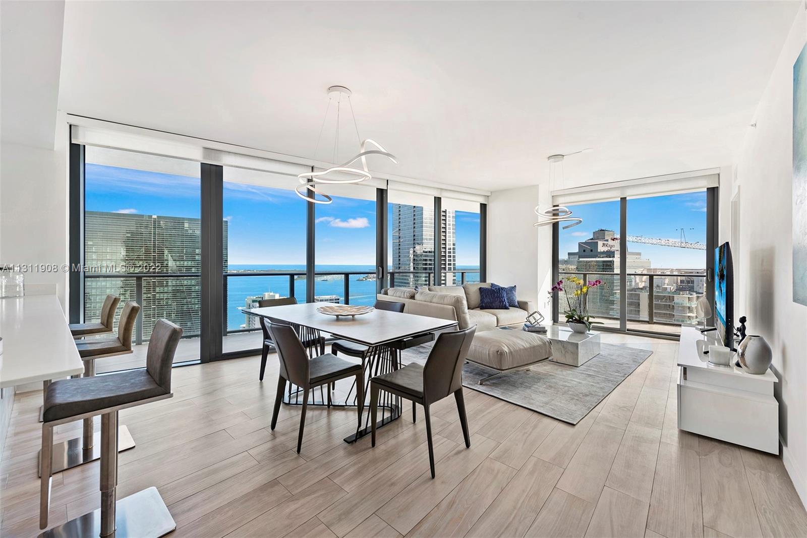 Beautiful corner unit with breath taking SE views at the SLS in Brickell. This 3 Bed + Den / 2.5 Bath residence has a large wrap around balcony with views of the ocean, Key Biscayne and coconut grove. Porcelain Floors Throughout And Top Of The Line Bosch Appliances. Blackouts/Shades Installed. Fully Furnished living area, office, master and second bedroom. Assigned Covered Parking Space. Great Location In Brickell!! Enjoy Resort-Style Living With The Best Amenities In Brickell Such As two pools, one of which is a Rooftop Deck/Pool, Fitness Center, Bar And Restaurants, Movie Theater And More!