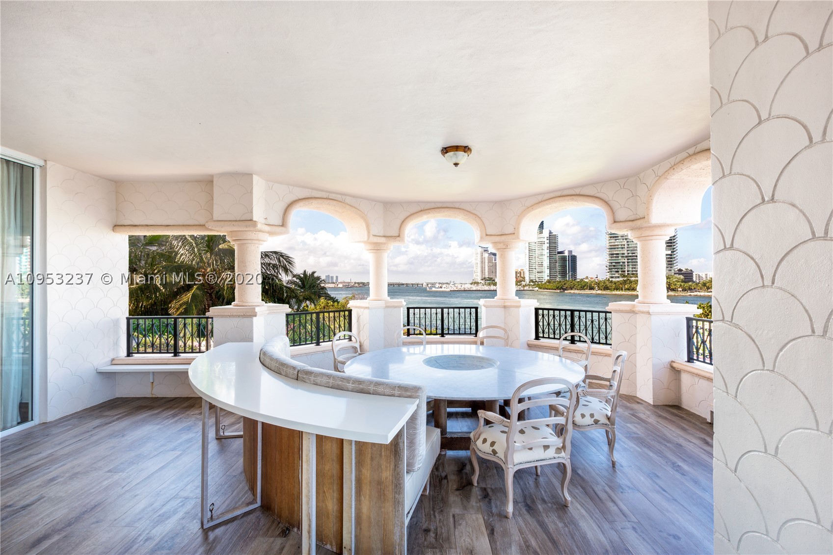 This luxurious residence at Fisher Island is a dream home! Spanning over 3800 SF, this magnificent waterfront unit graced by expansive wrap-around balconies is a haven for relaxation. Voluminous layout made perfectly for entertaining combined with a wine cellar that creates an intimate tasting area for wine lovers. Beautiful kitchen with a great informal eating space overlooking the water. Gorgeous built-ins throughout the entire unit, no details spared. Become a part of this exclusive lifestyle, with a private beach, marina, golf course, tennis courts, and much more...